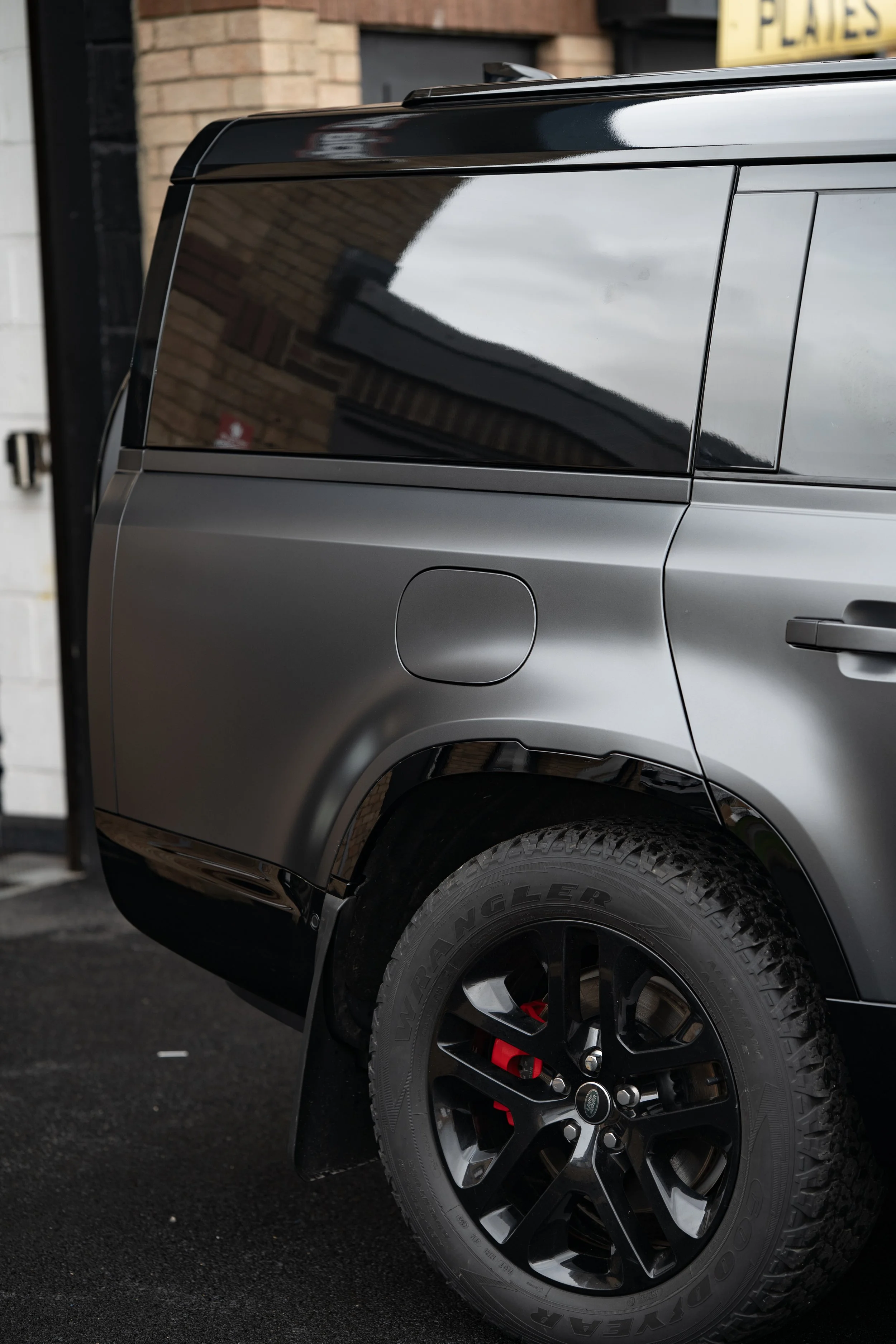 Seamless panel coverage on a satin Defender 110. Our PPF installations preserve the original look while adding long-term protection against scratches and staining.