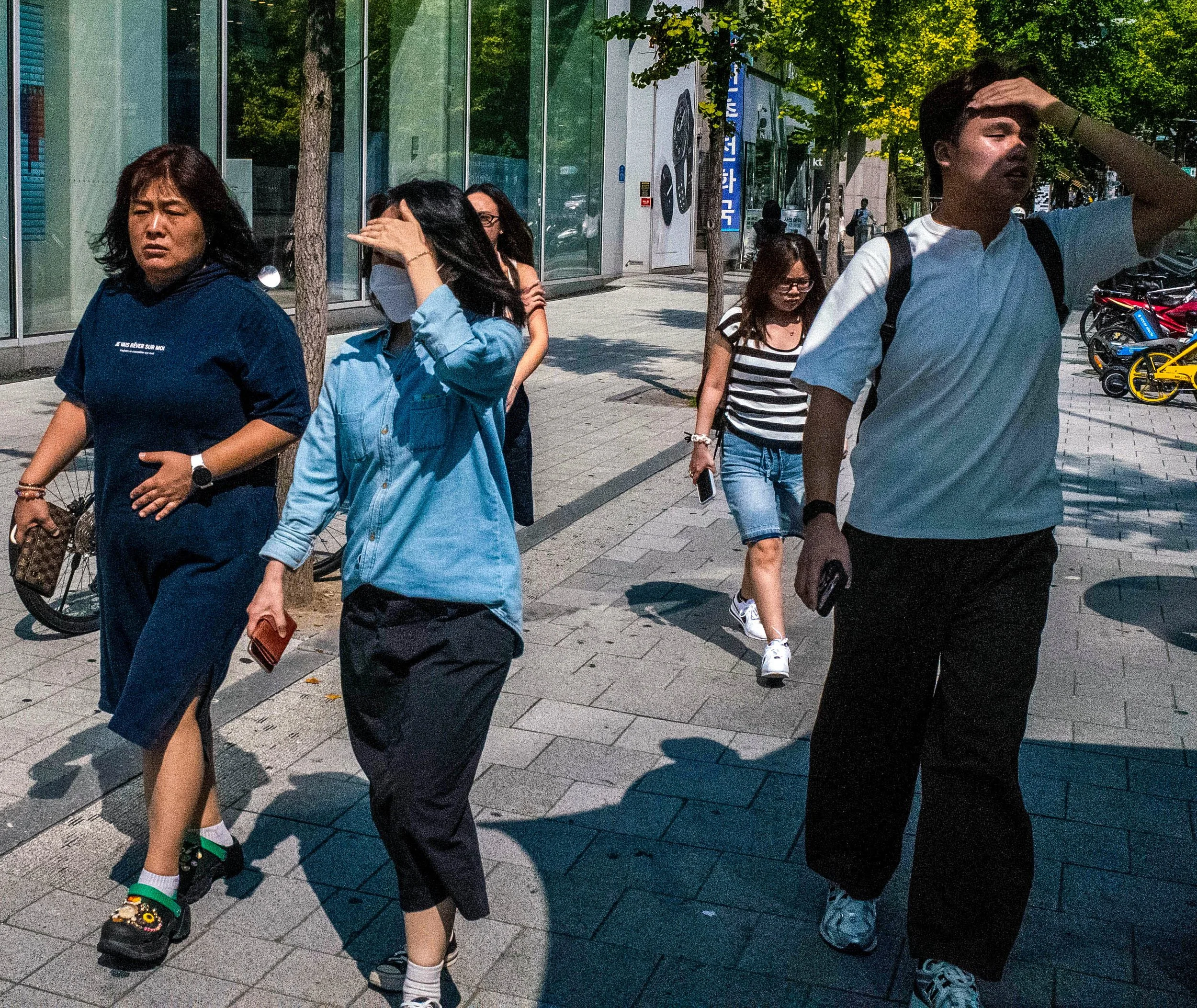 Hongdae near Hongik University, a bustling hub for indie music, street art, dance performances, and K-pop buskers.