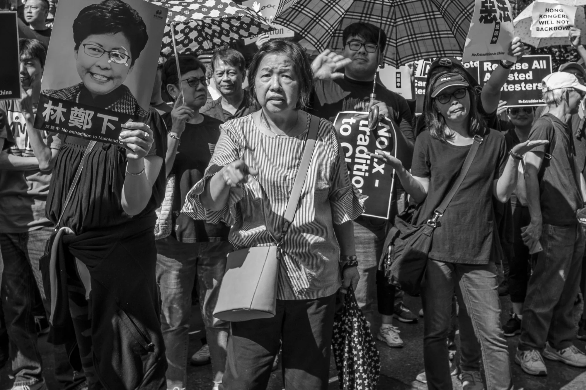 Richard Keshen – The Face of the Protestor


The volume of noise can be heard off of the reverberation from the tall office towers quite a distance away. As you inch closer it becomes clear that there’s a protest underway. The chant of the protest le
