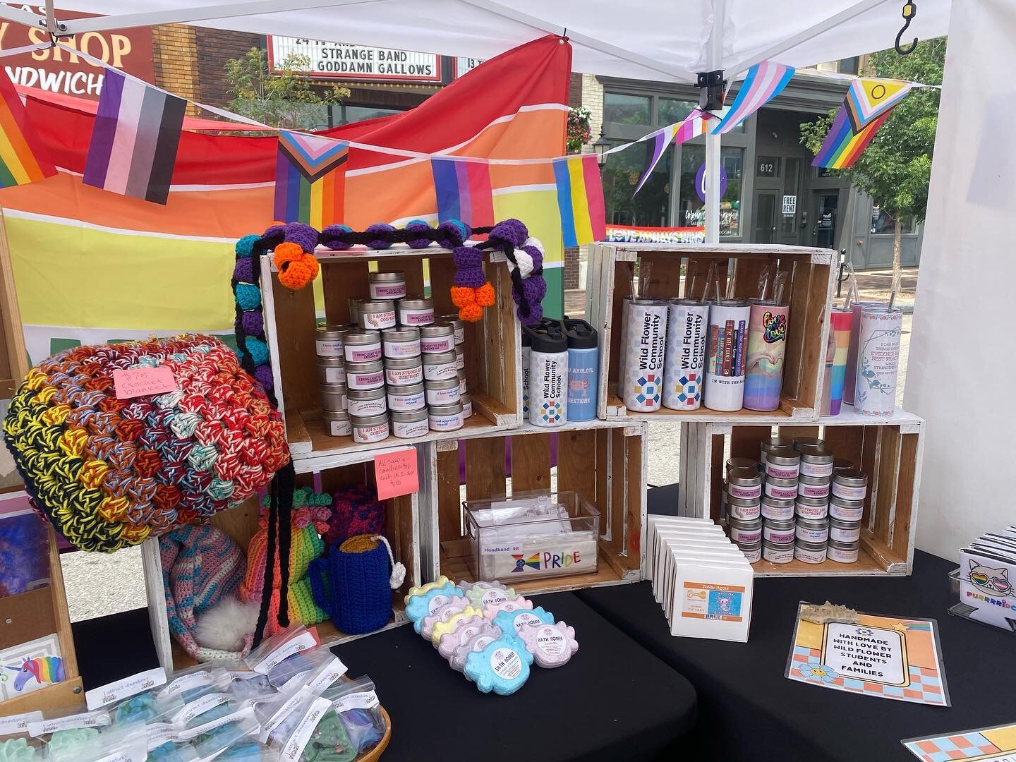 Come see us at Pride at the Park!!! We have so many handmade goodies made by our students and families! Come support our scholarship fund! We will be here till 11 tonight at Naftzger Park 🫶🏼