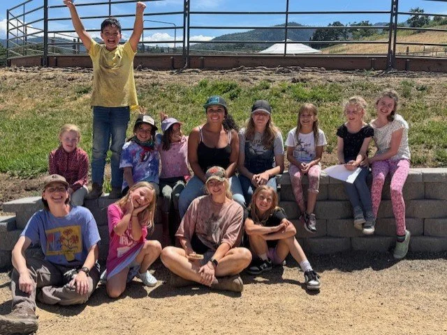 camp group pose sitting on wall.jpeg
