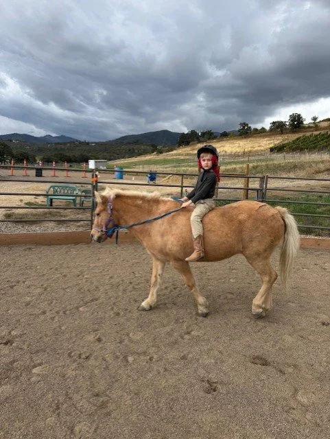 Liam riding Rosie.jpeg