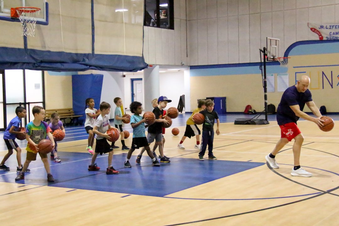 Coach Rich Sandler teaching basketball fundamentals.