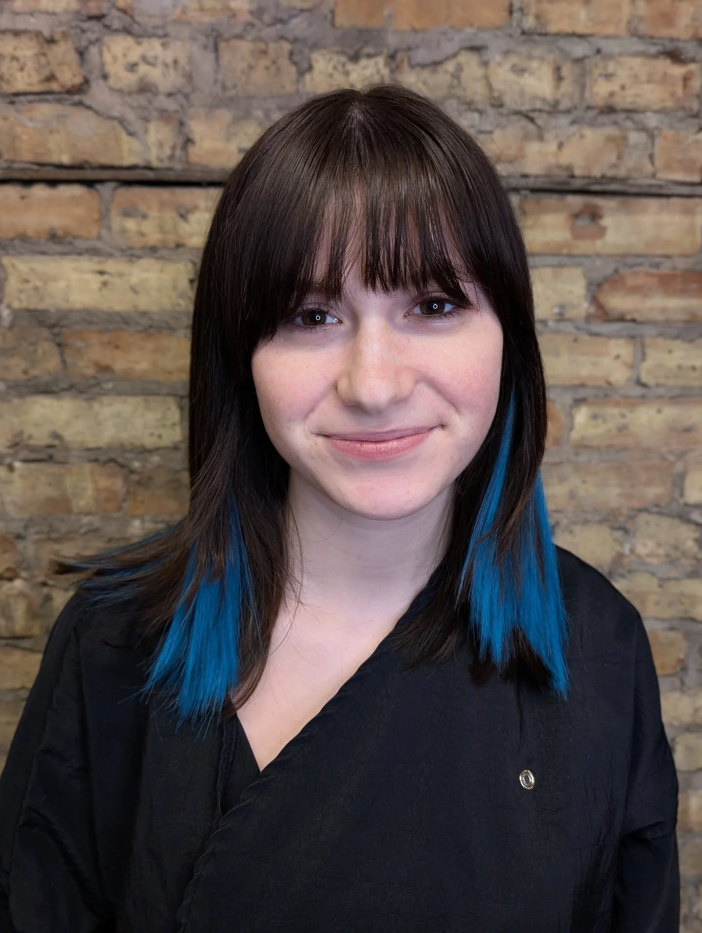 All the fun without the risk! 

Extensions by Molly 

This client wanted peek-a-boo blue in her dark hair. The benefits of using extensions include:

&bull; no bleach required = no hair damage 

&bull; customizable 

&bull; removable + reusable (with