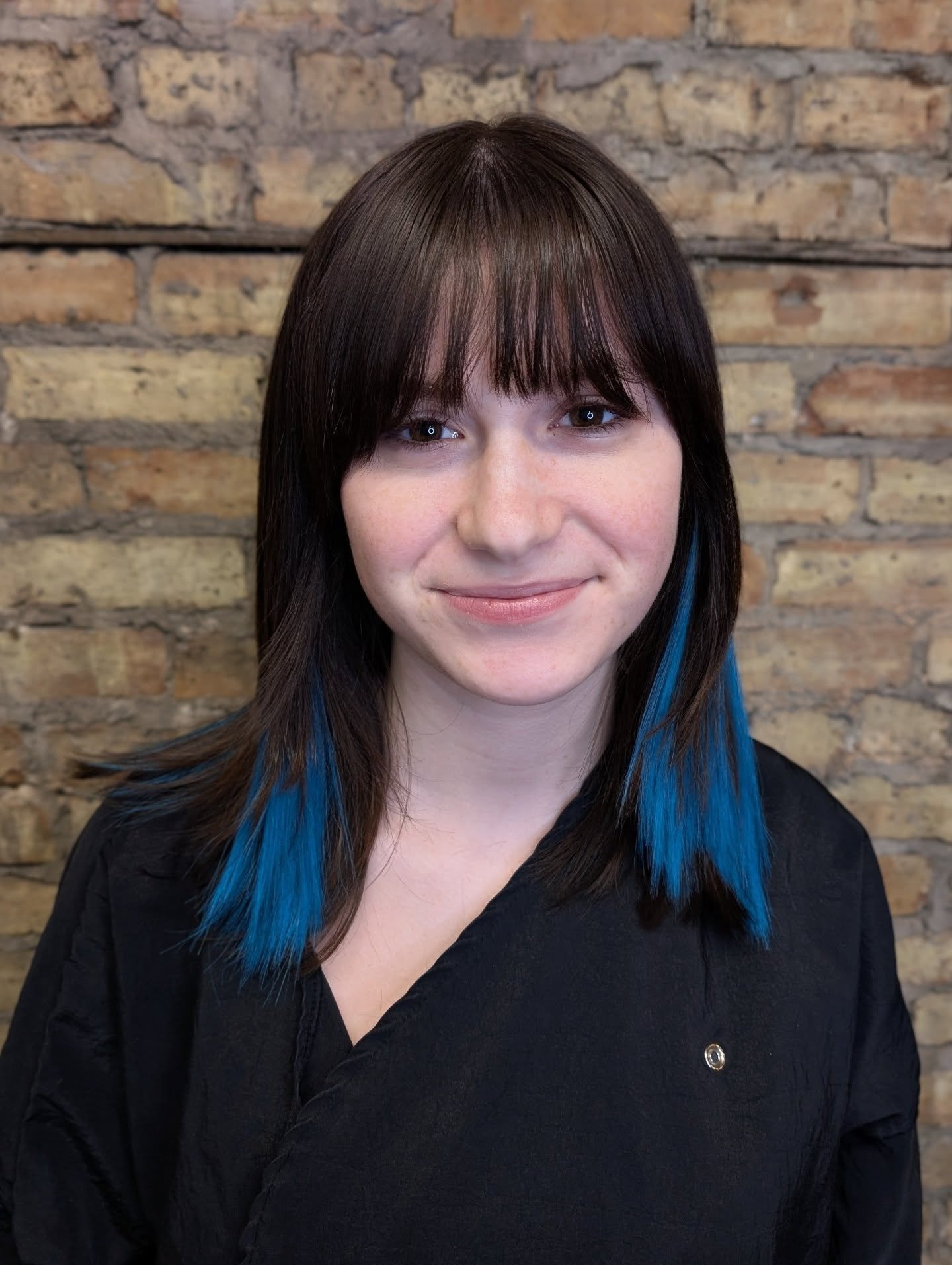 All the fun without the risk! 

Extensions by Molly 

This client wanted peek-a-boo blue in her dark hair. The benefits of using extensions include:

&bull; no bleach required = no hair damage 

&bull; customizable 

&bull; removable + reusable (with