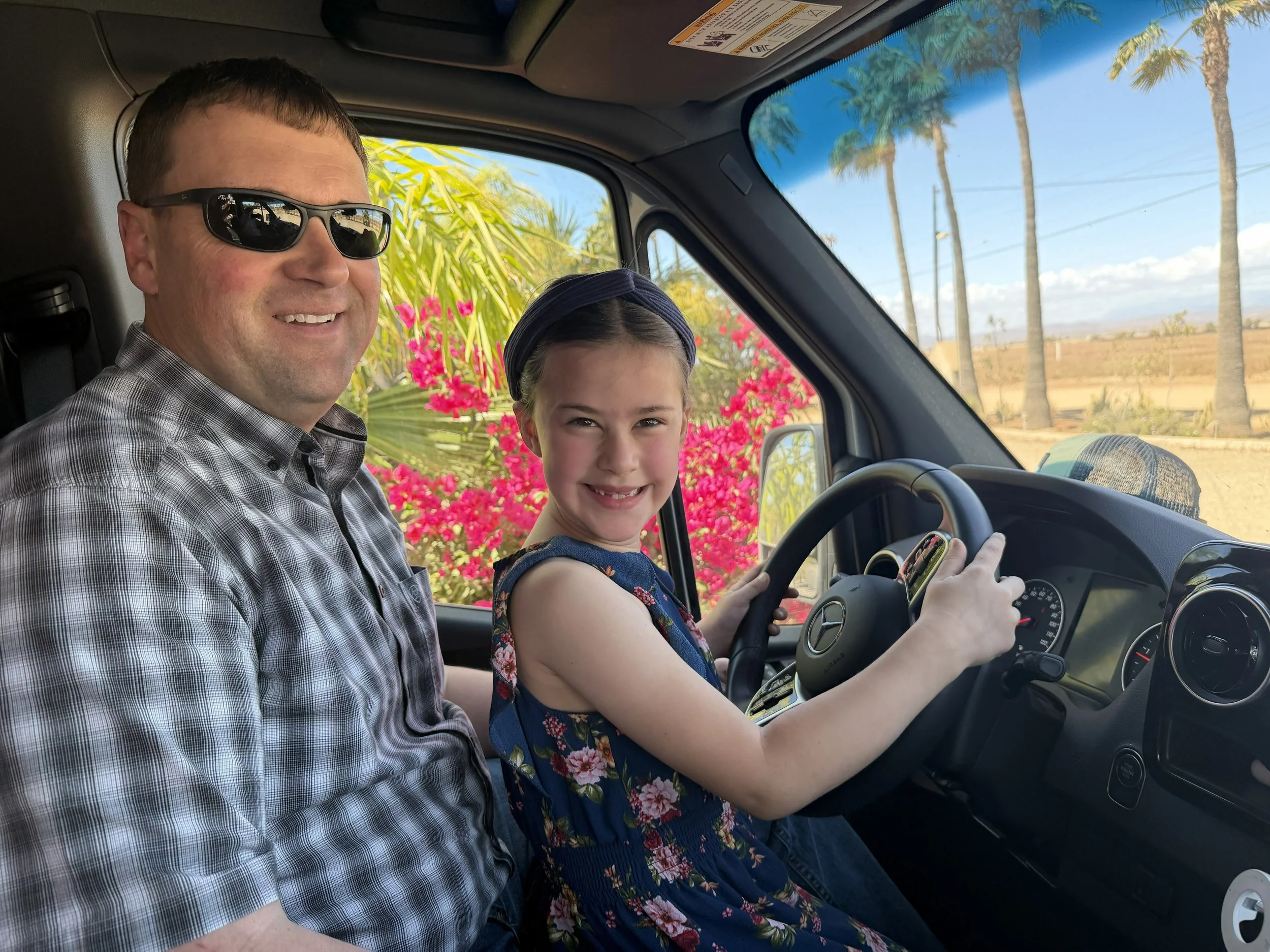 Martin let six-year-old Aviyah drive the big van for the first time. She saw oncoming traffic coming in our direction on the dirt road and said, "They're coming in hot!",