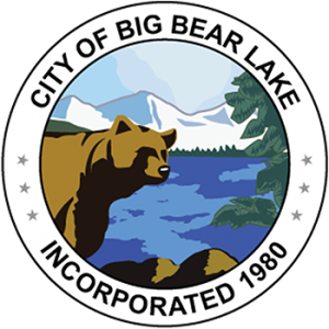 City of Big Bear Lake logo seal featuring illustration of bear in front of lake with snowy mountains in the background.