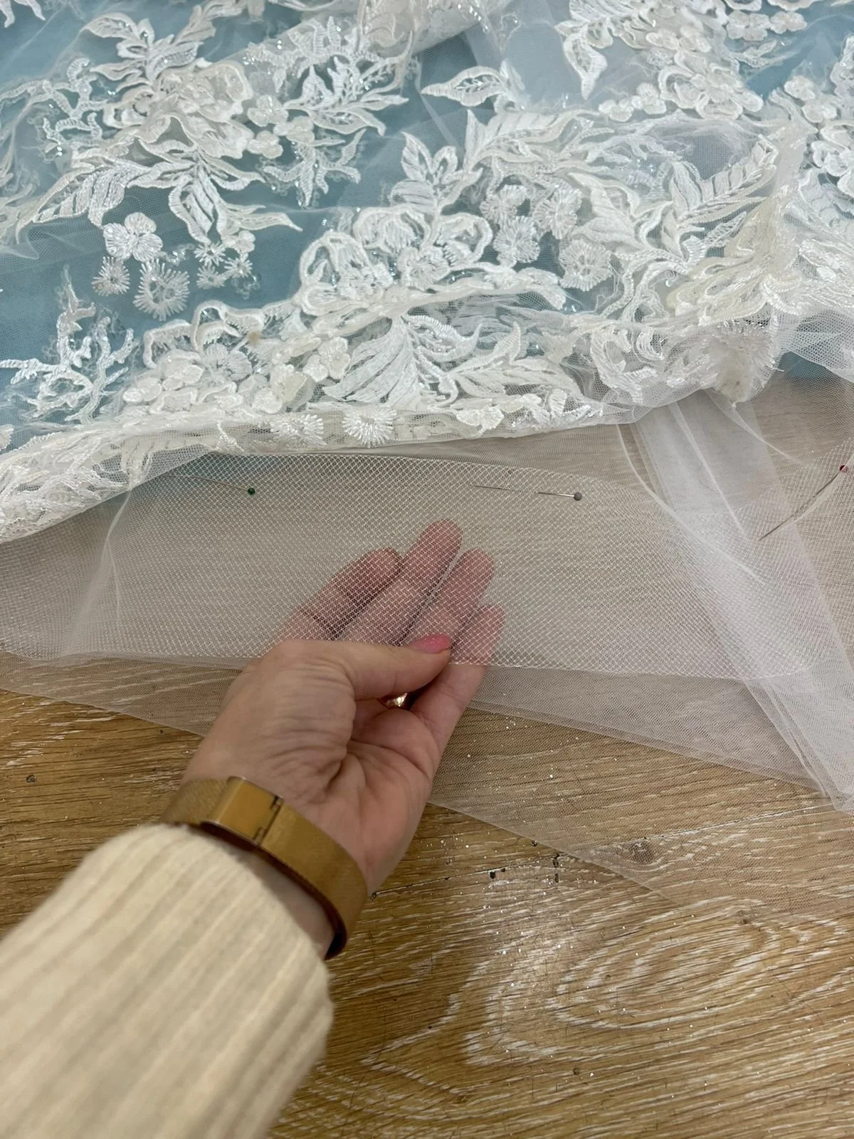 Final Touches: A Wedding Gown Unlike Any Other
The finishing stage—delicate lace, sheer layers, and a sculpted silhouette come together for a once-in-a-lifetime couture bridal gown. This is why bespoke design is worth it.