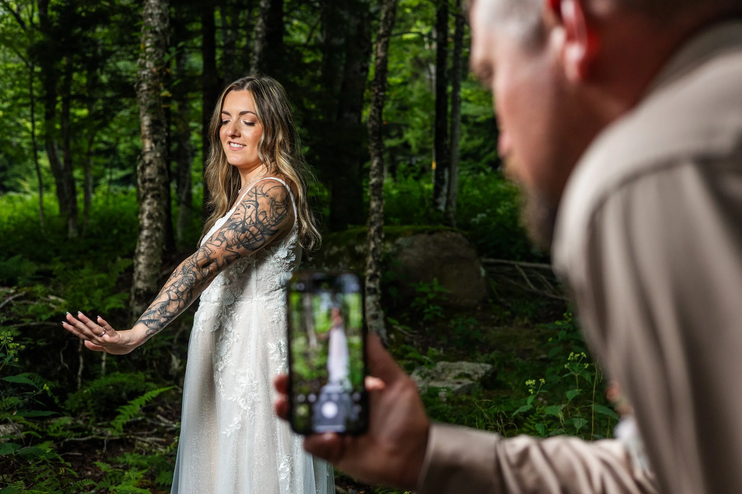 Snapping photos of the bride.