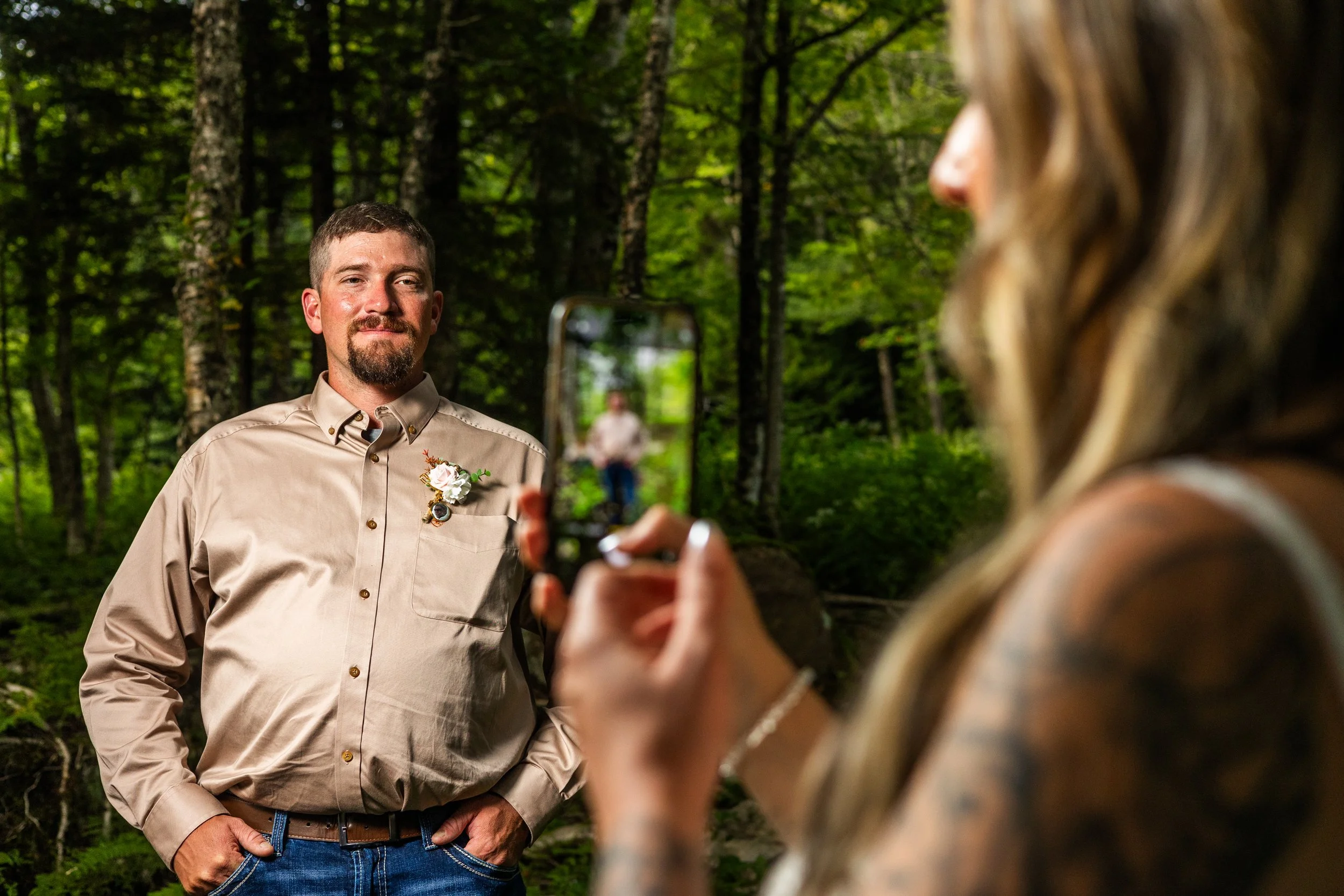 Snapping photos of the groom