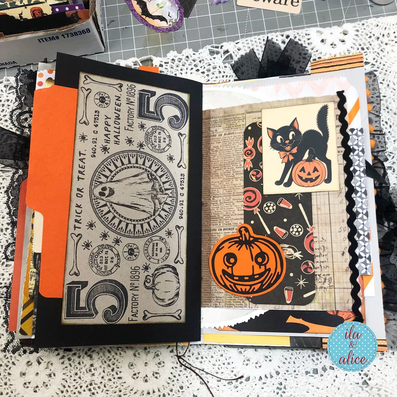 Layered Halloween journal pages featuring vintage black cats, a ghost, pumpkins, candy, orange pockets and black rickrack