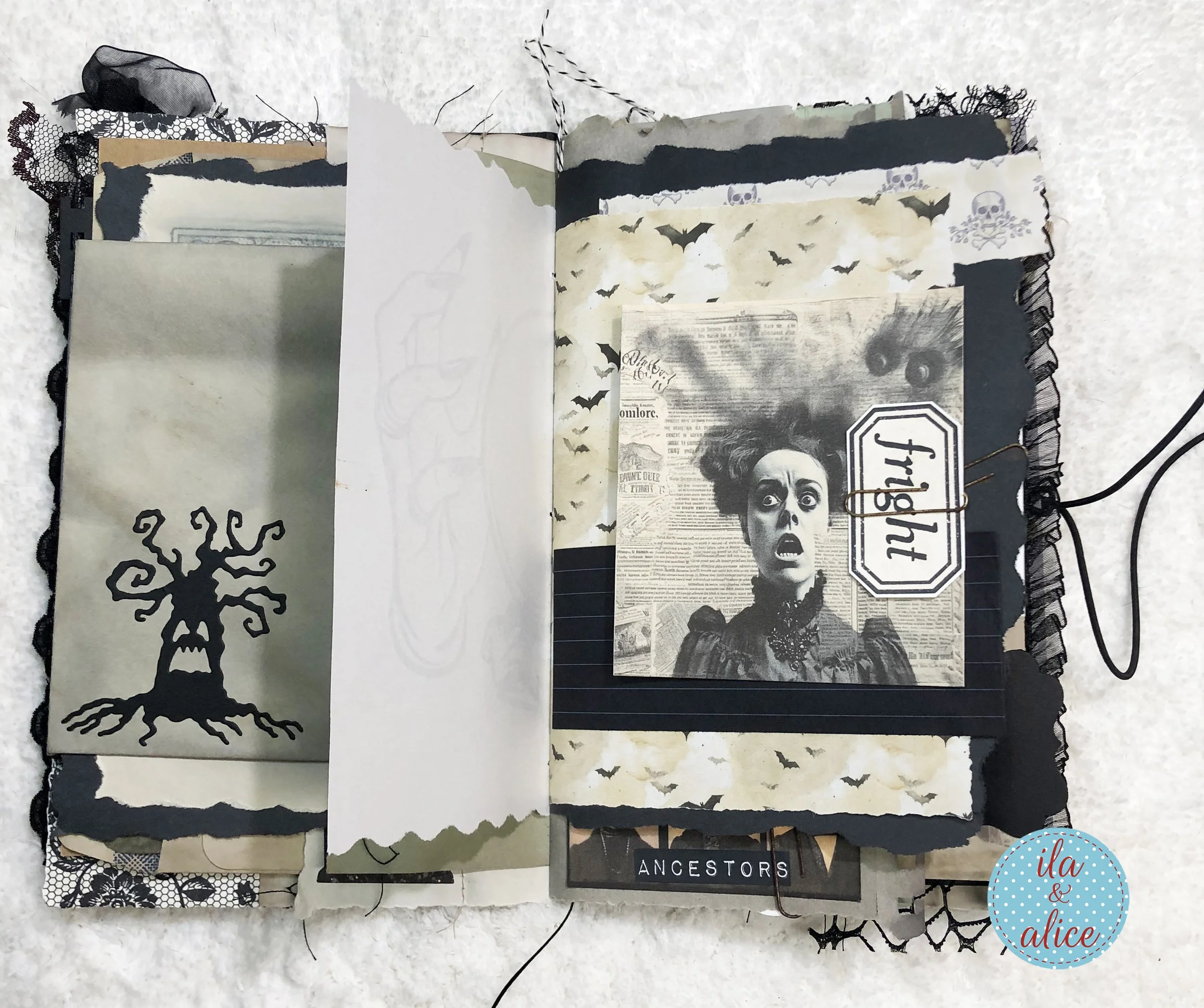 Handmade Halloween journal spread with vintage bat illustrations, aged papers, black lace and a FRIGHT tag tucked into a paper pocket.