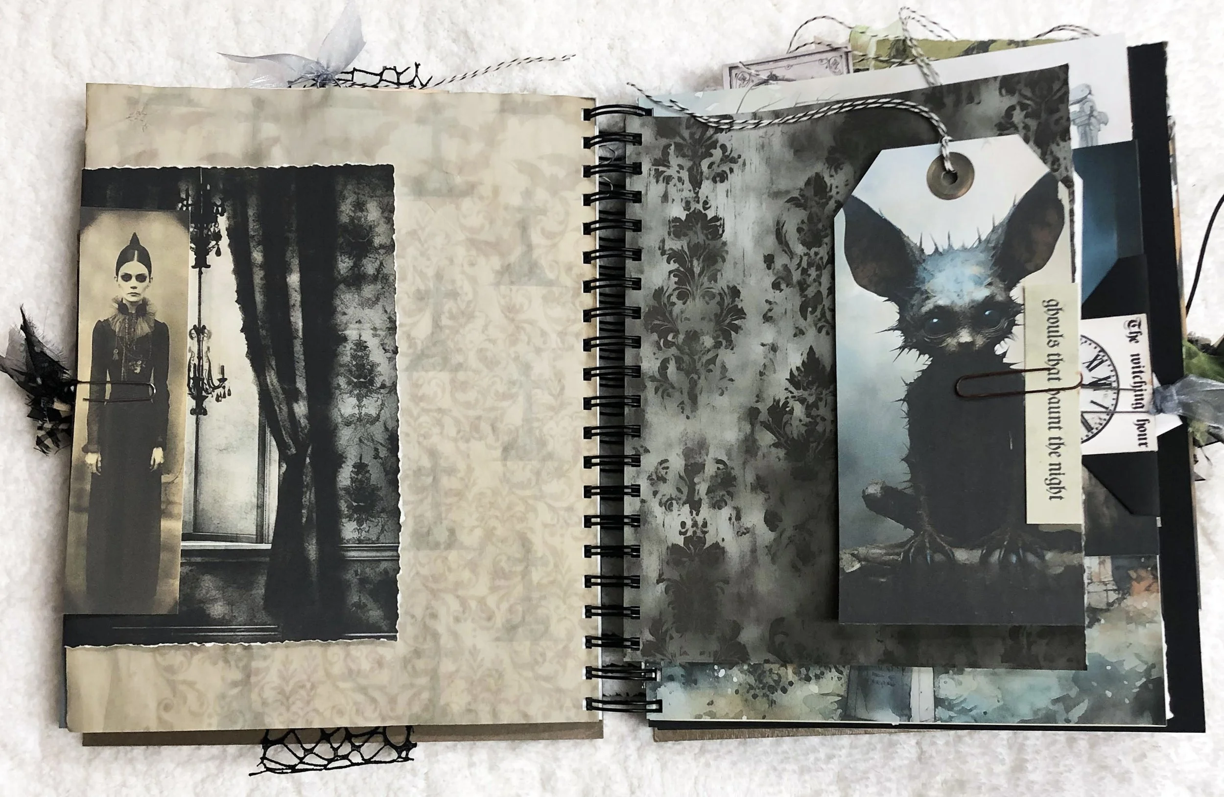 Gothic journal spread with a Victorian girl, black bat tag, layered pockets and distressed papers.