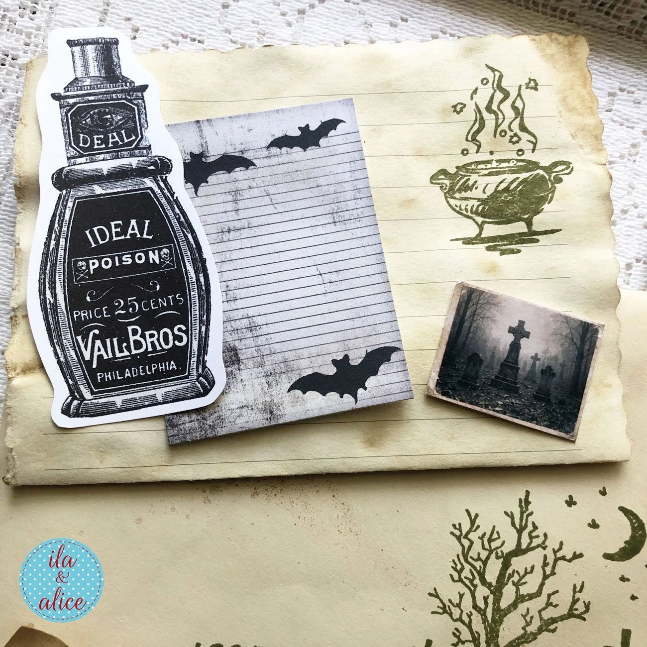 Coffee-dyed Halloween journal papers with a vintage poison-bottle cutout, bat-covered writing card, stamped cauldron and a small foggy graveyard image.