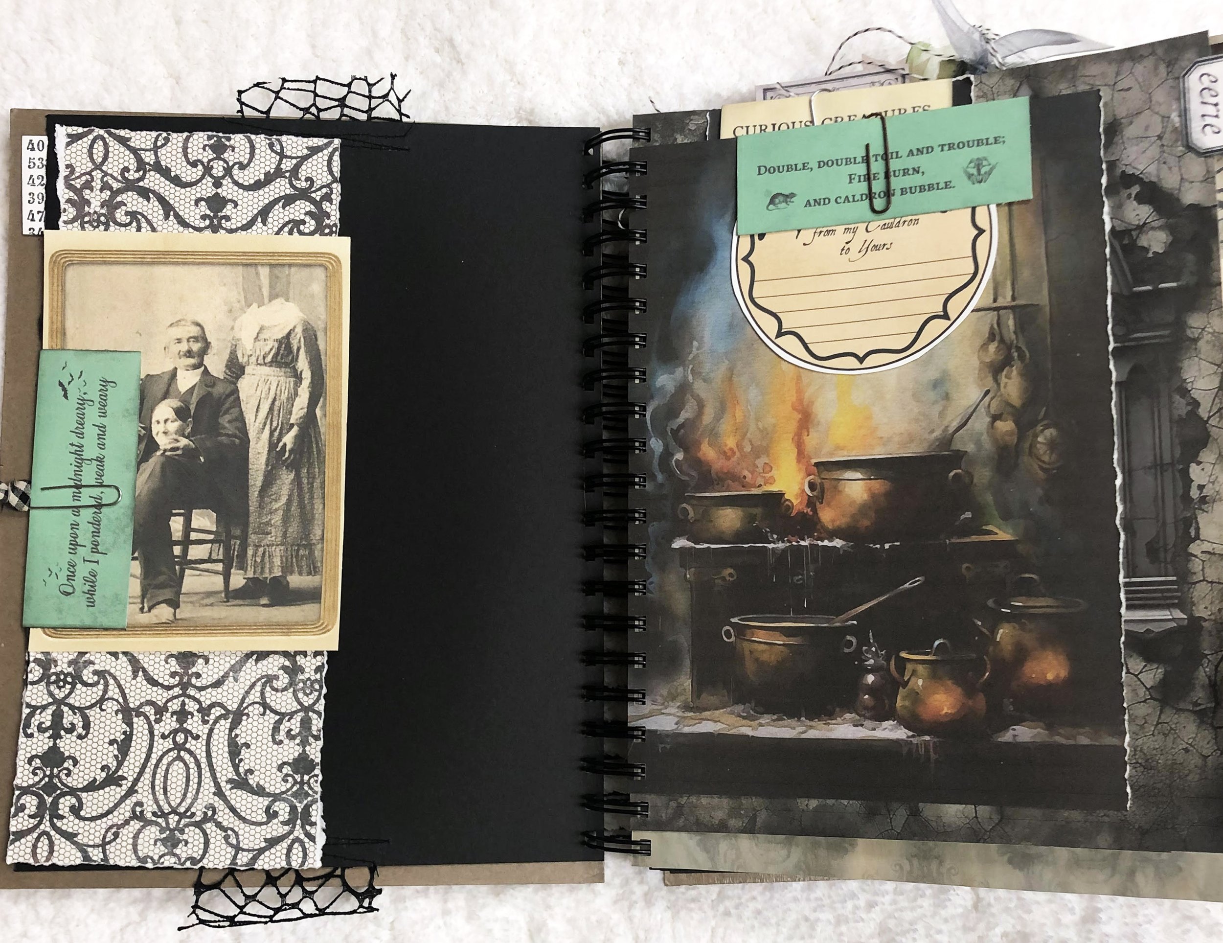 Open junk journal spread with a vintage séance portrait, lace patterns, spell cards and a glowing witch’s cauldron.