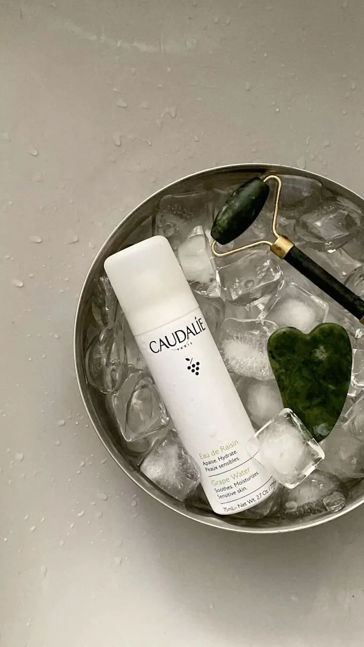 Skincare product and facial massage tools displayed on ice, representing product recommendations, skin cooling tools, and personalised skincare routine guidance for men