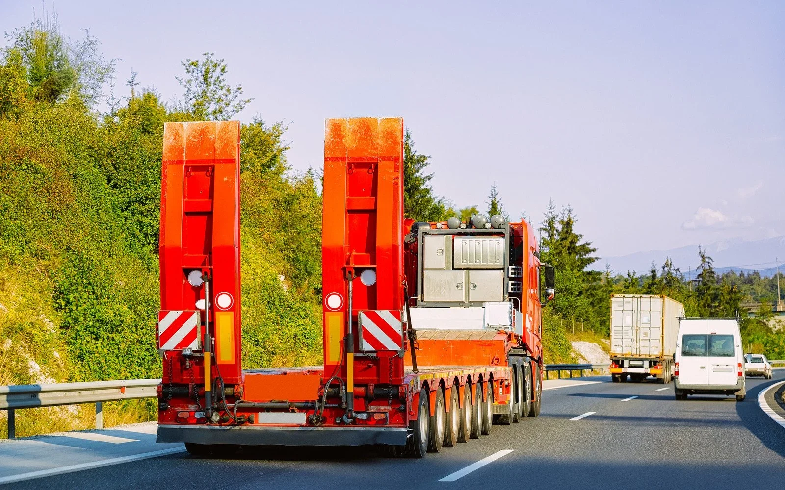 Lowboys and Landolls Services: The Difference Between a Lowboy and a Landoll Trailer and When Each One Is the Right Call