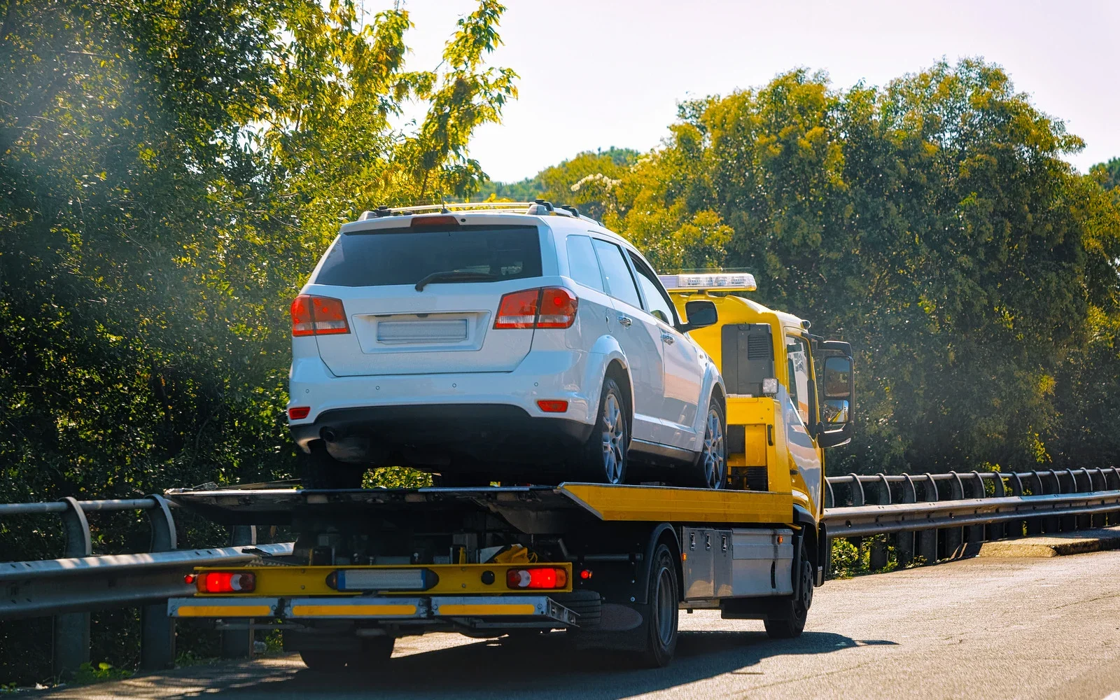 How to Transport Low-Profile Cars Using a Flatbed Tow Truck