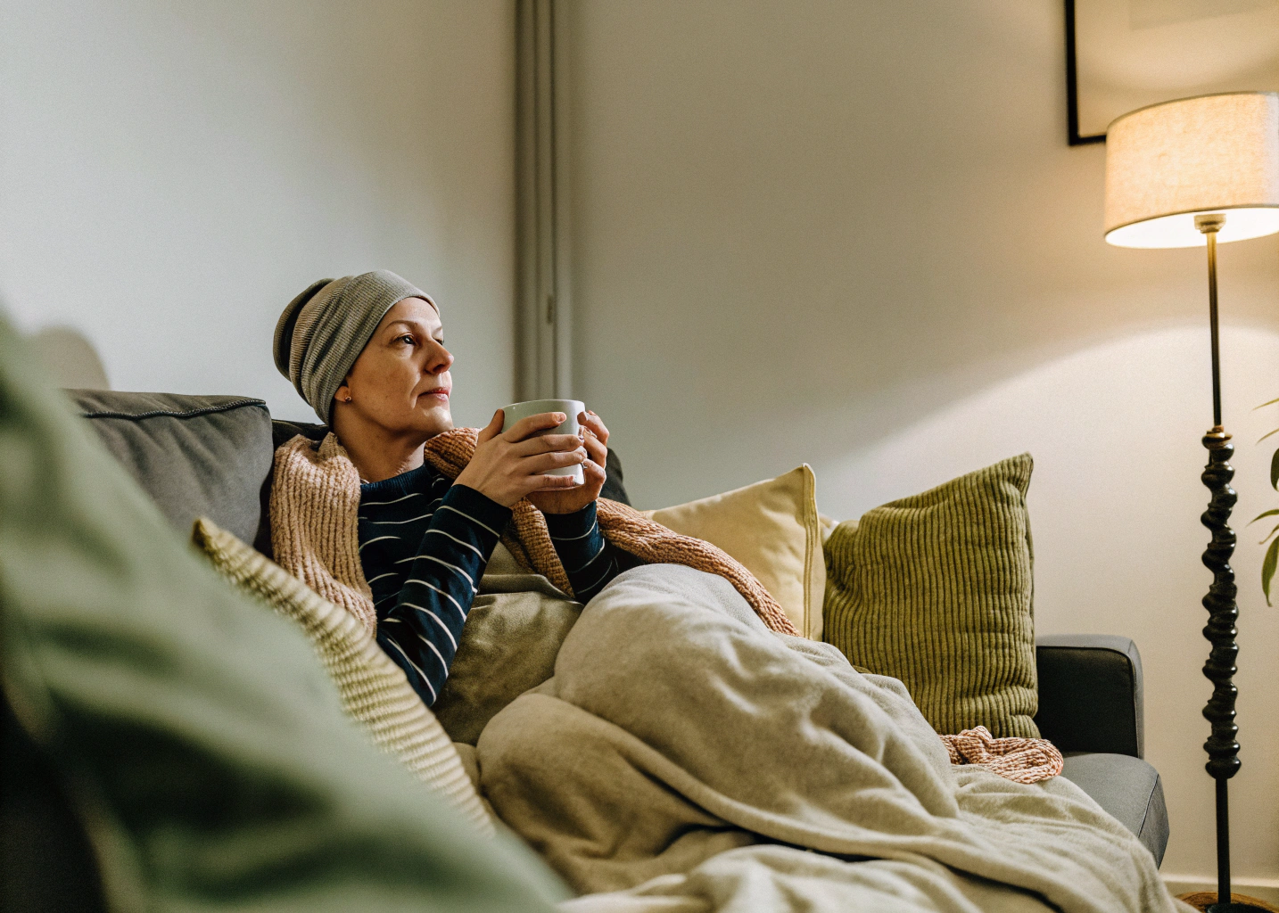 parent with cancer sitting on a couch