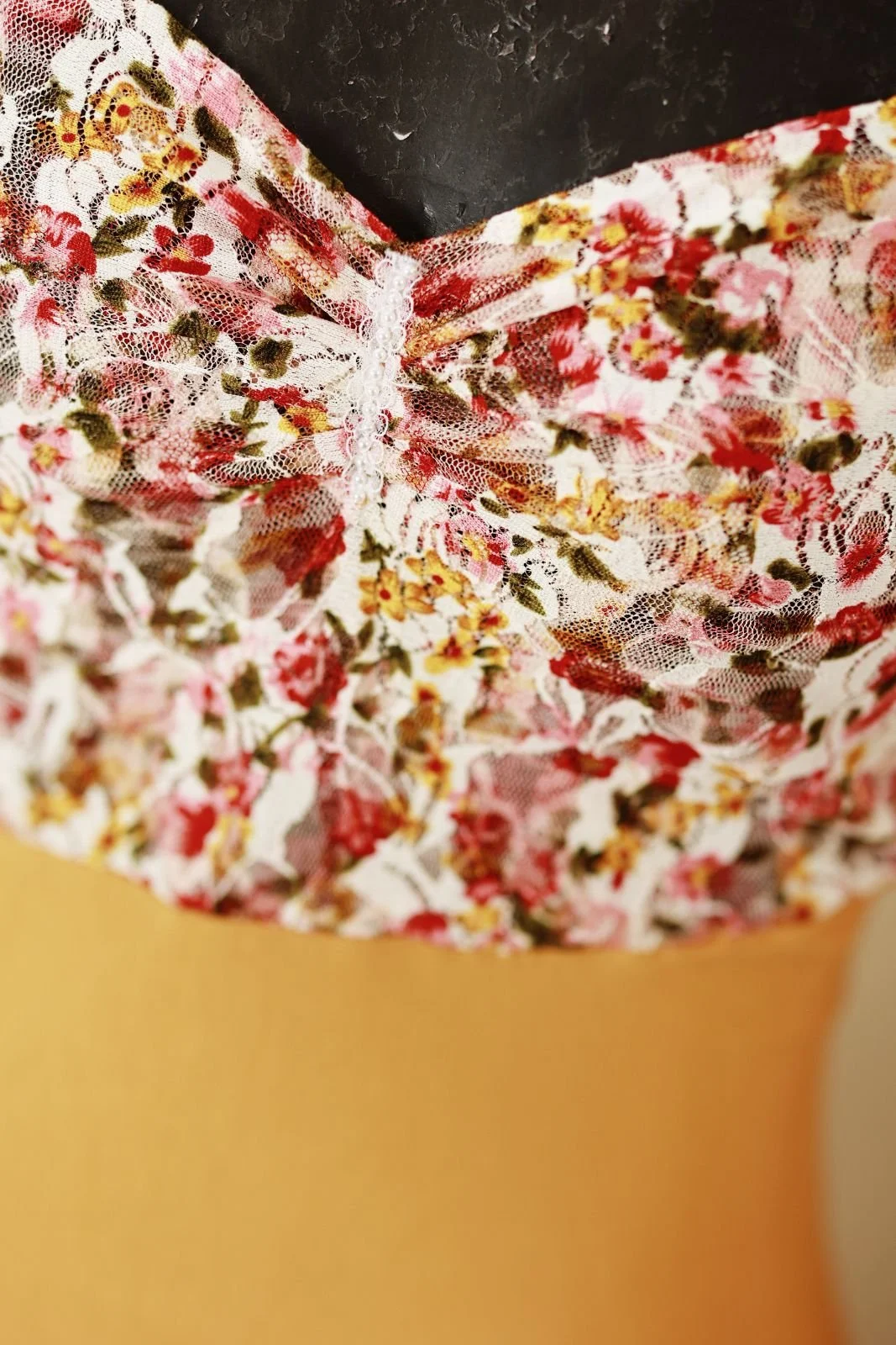 Close up of fitted textured top on bodycon mermaid designer gown
