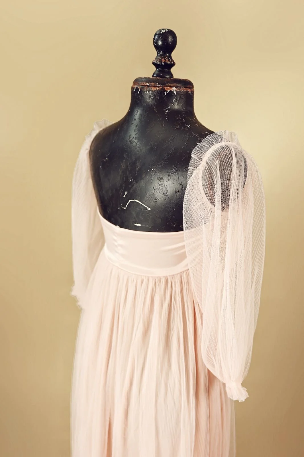 Back view of pastel pink maternity dress