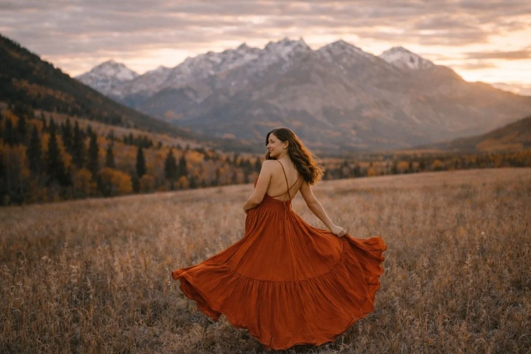 AI generated image of a pregnant woman wearing an orange designer boho dress in maternity photoshoot