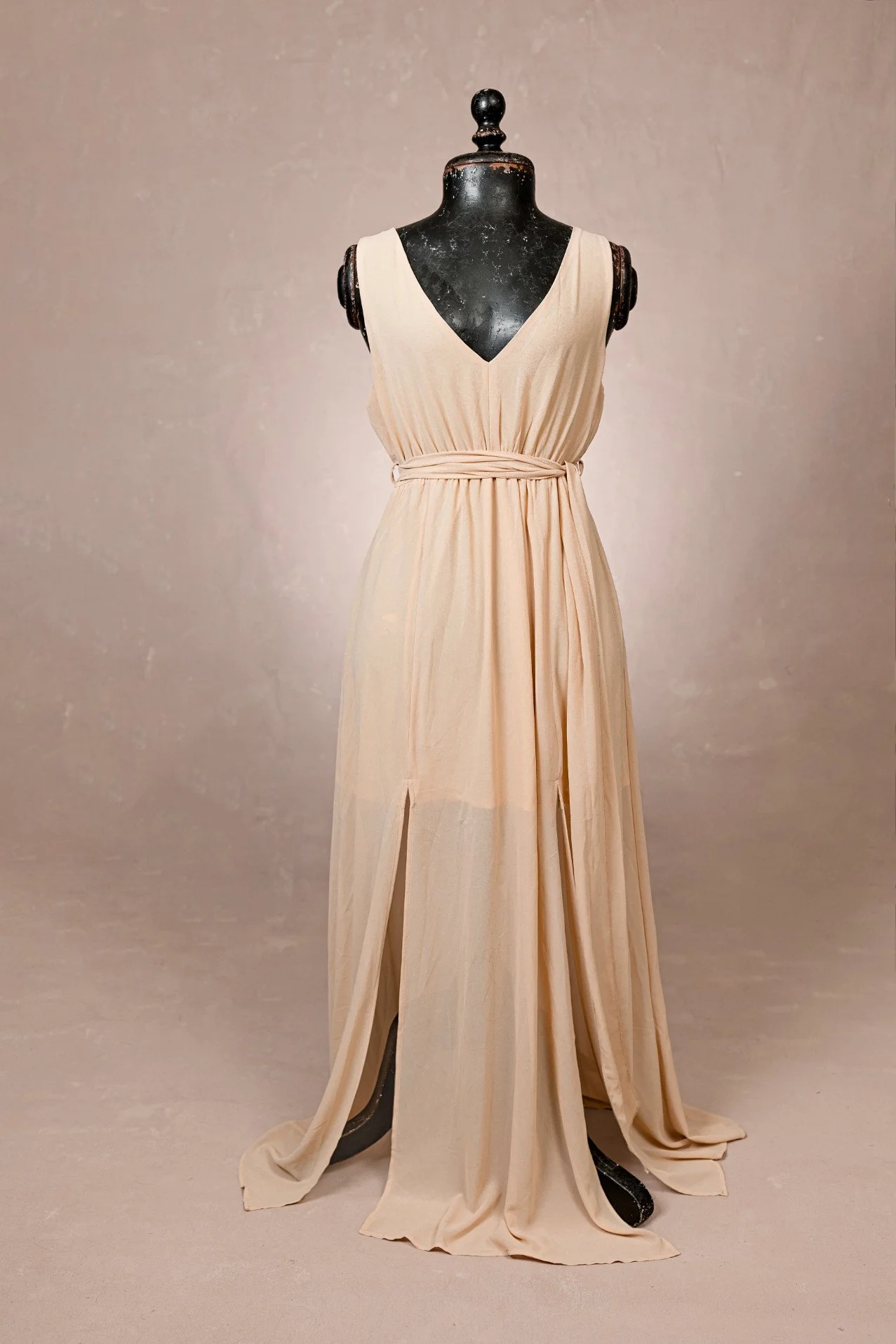 Cream beige maternity rental dress, with V-neck, sash waist, leg side slits, and sleeveless design