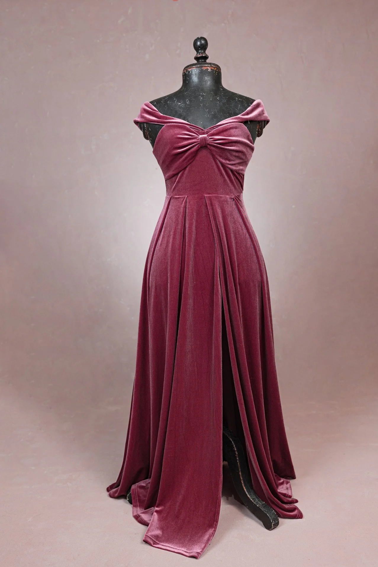 Dusty rose pink velvet maternity rental dress with front leg slit