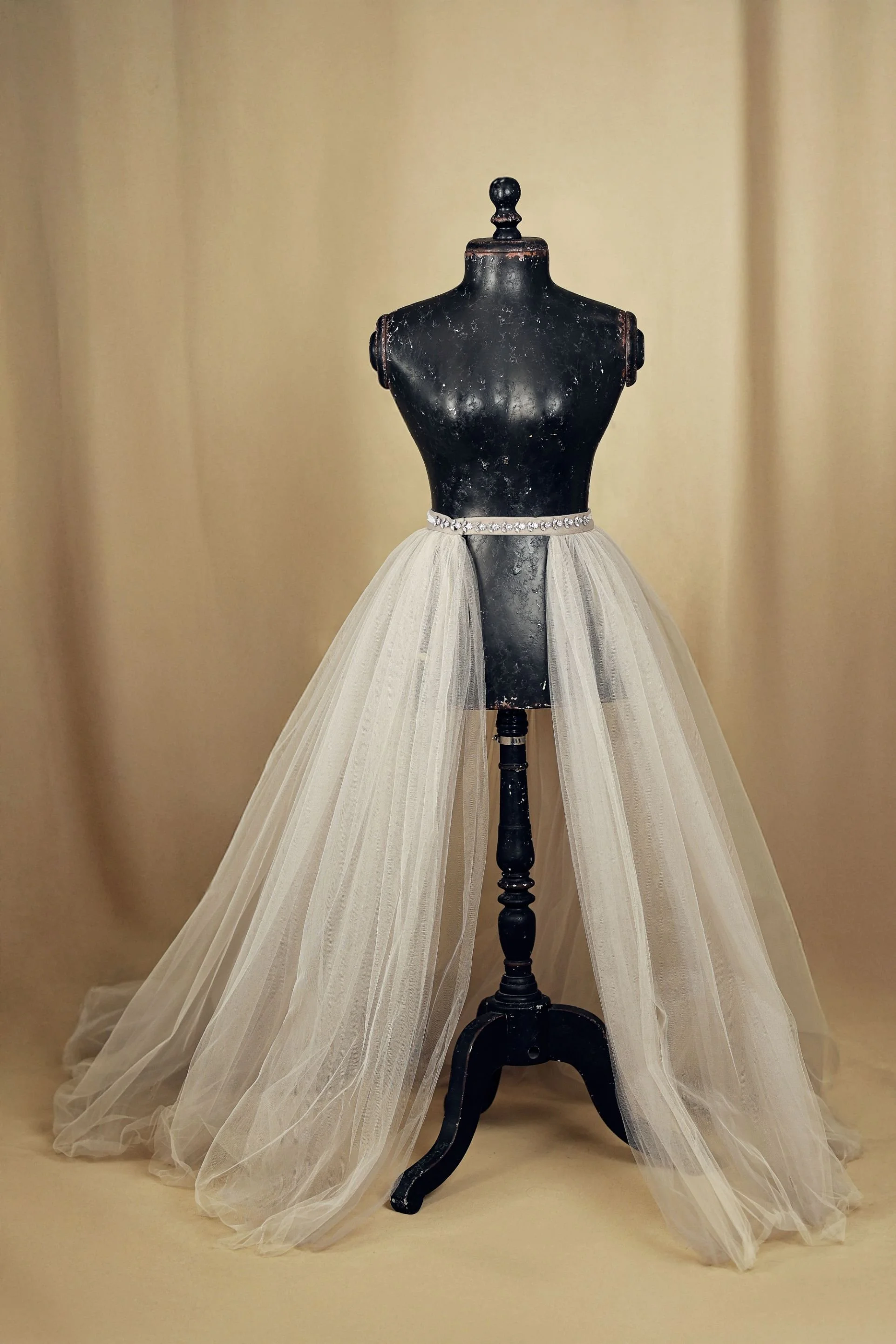 Beige maternity and family photoshoot skirt on a mannequin