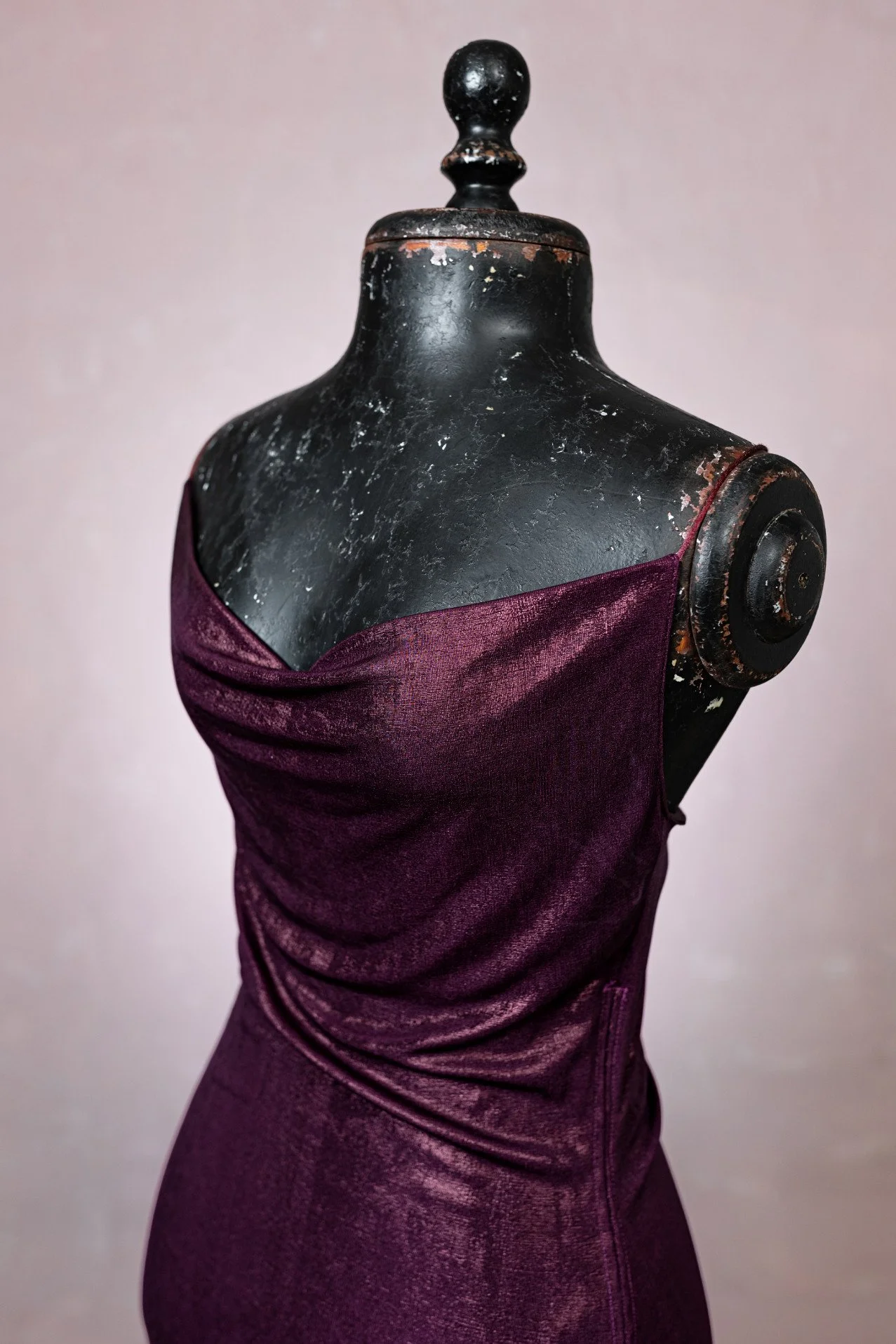 CLose up of bodycon dress cowl neck and strappy shoulders