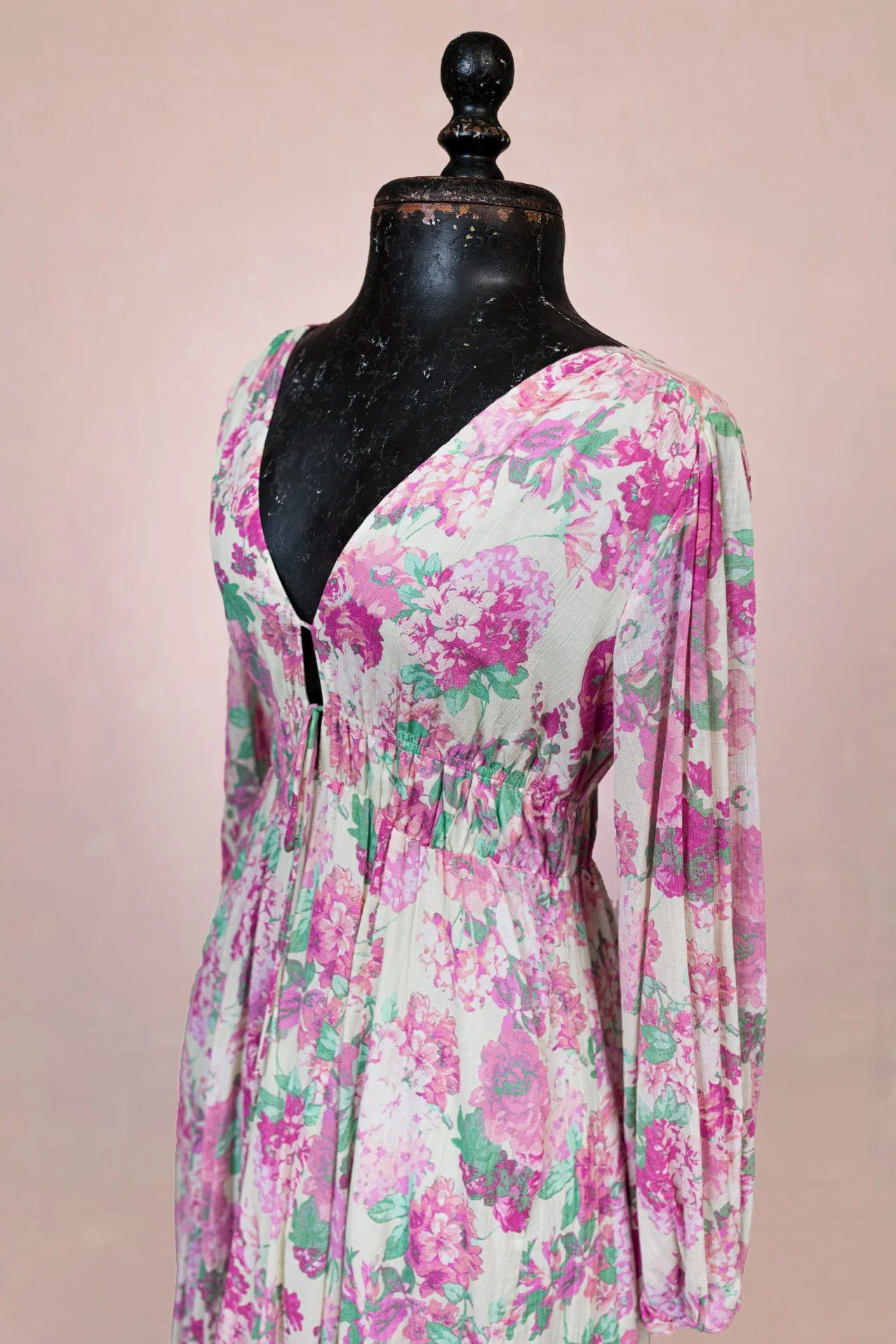Close up of peony floral print dress, showing v-neck
