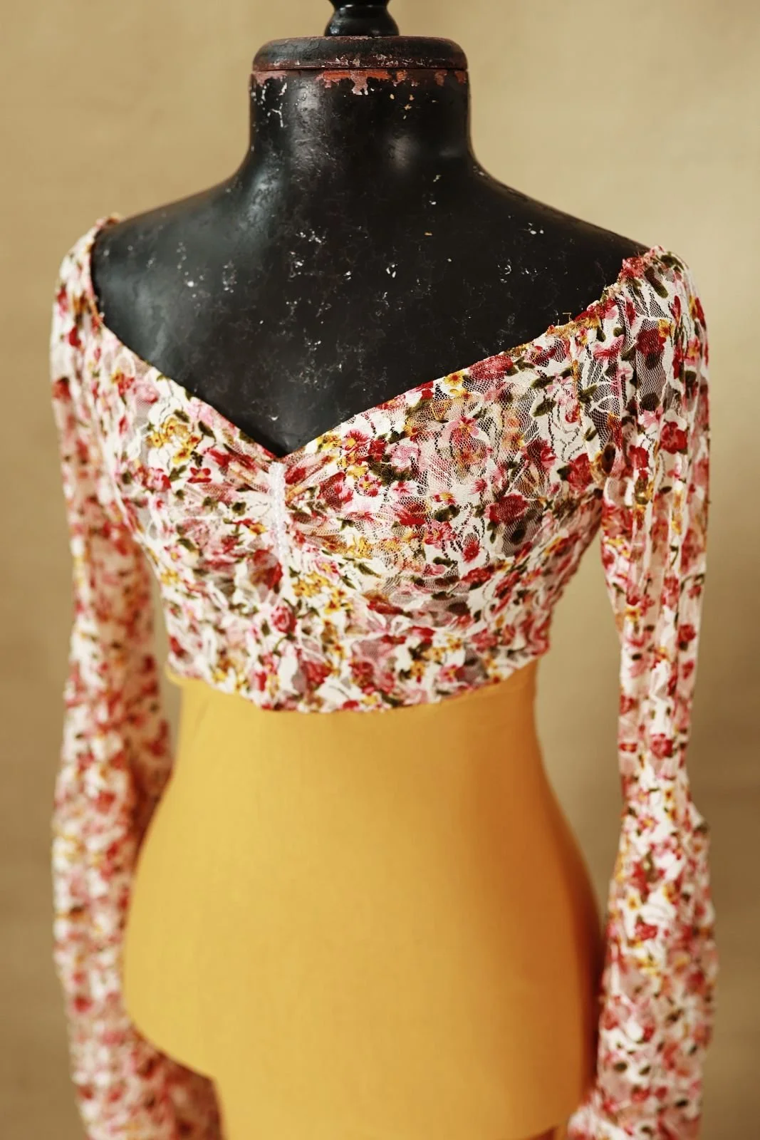 Close up of fitted textured top on bodycon mermaid designer gown
