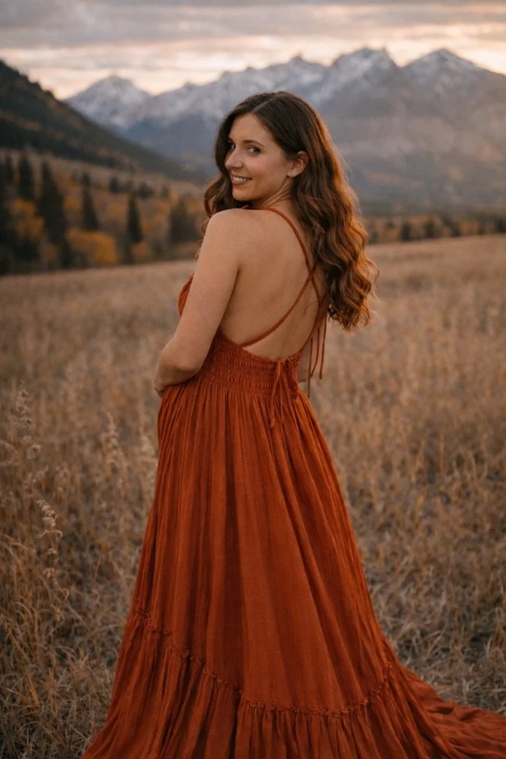 AI generated image of a pregnant woman wearing an orange designer boho dress in maternity photoshoot