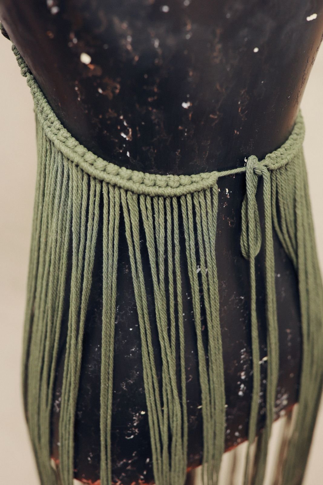 Back view of boho macrame beach dress, showing open back cut