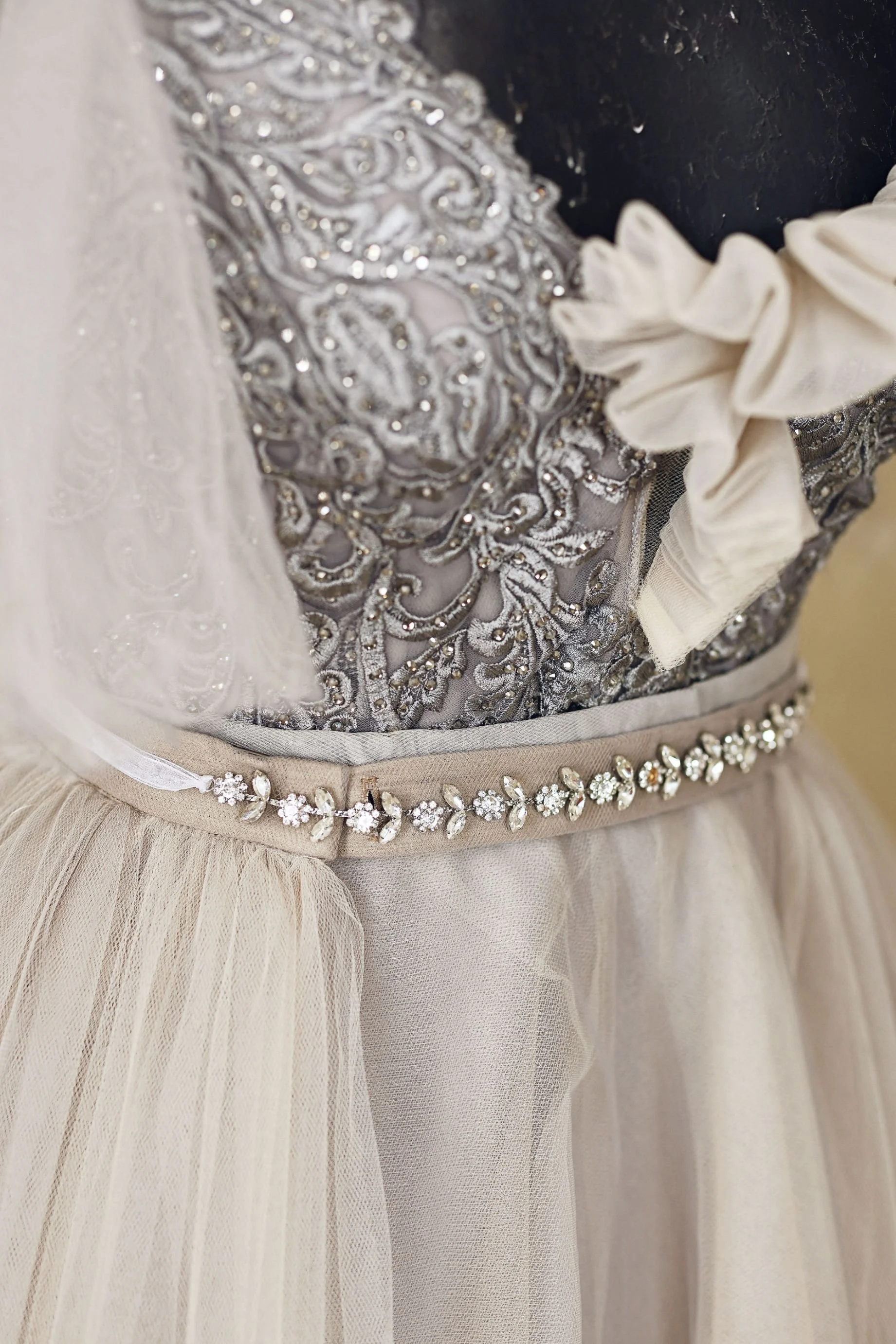 Close up of silver embroidered corset on tulle gown