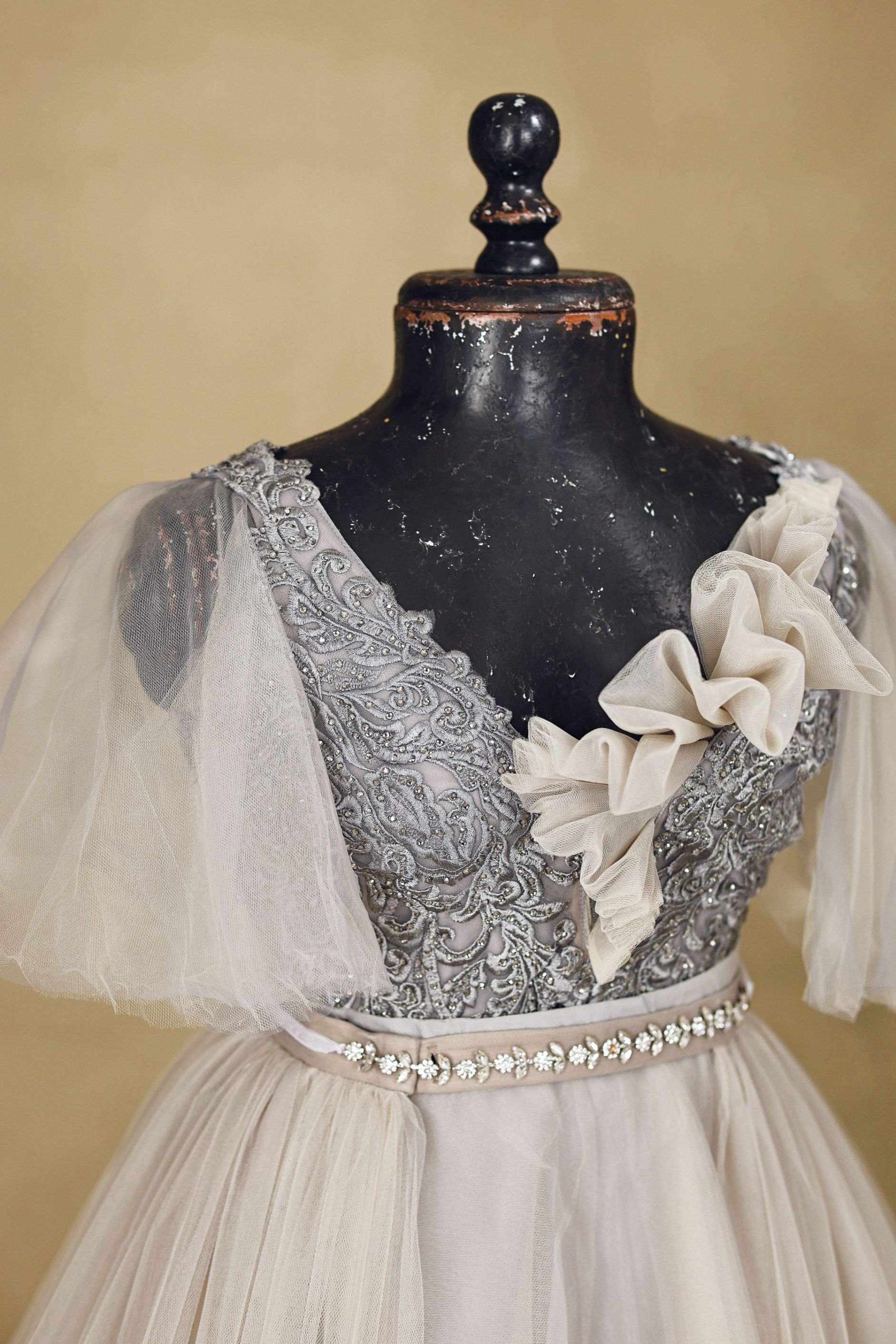 Close up of embroidered corset on tulle gown