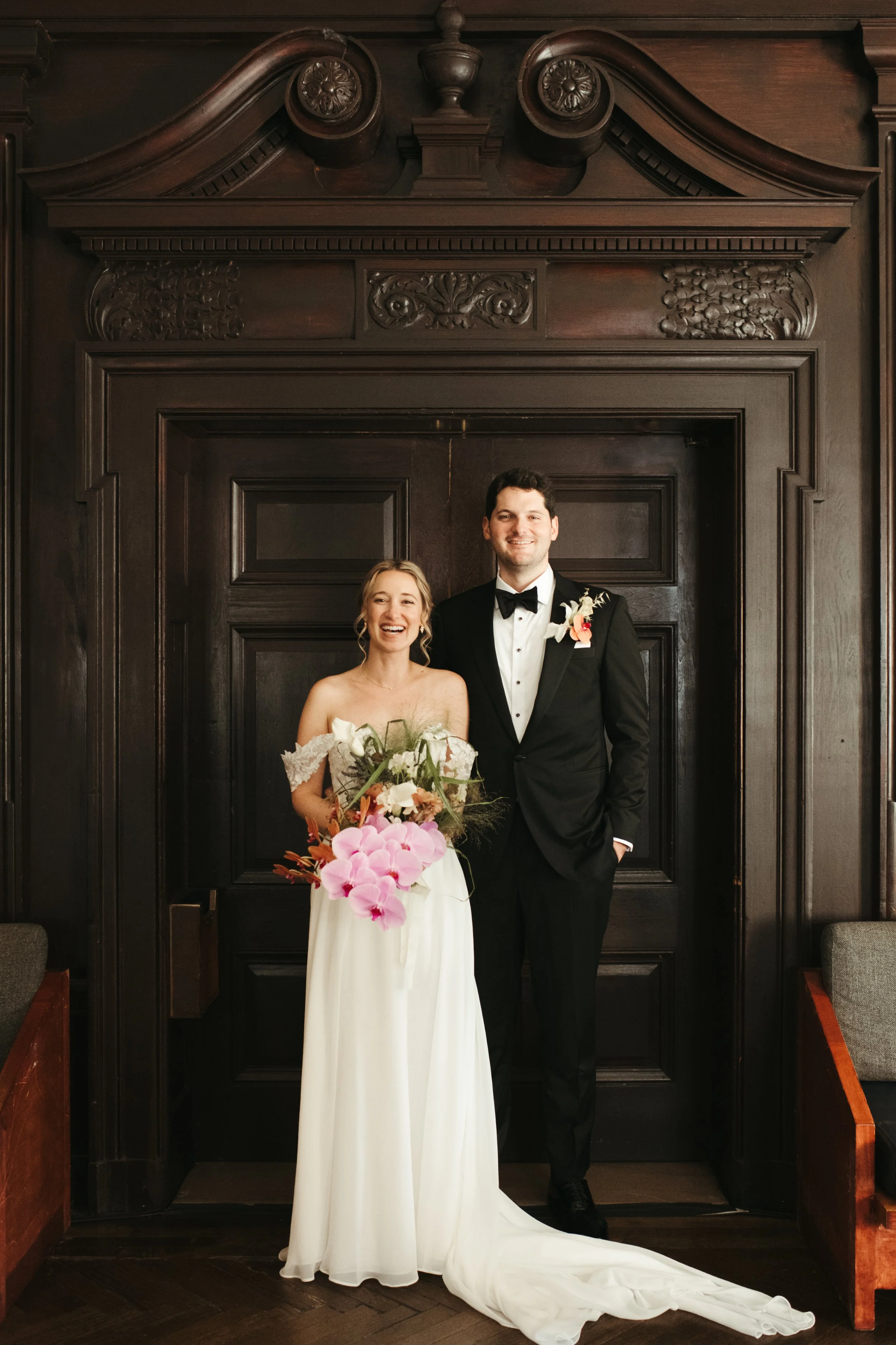 A bride and groom standing in the Bar Calico doorway pre wedding ceremony