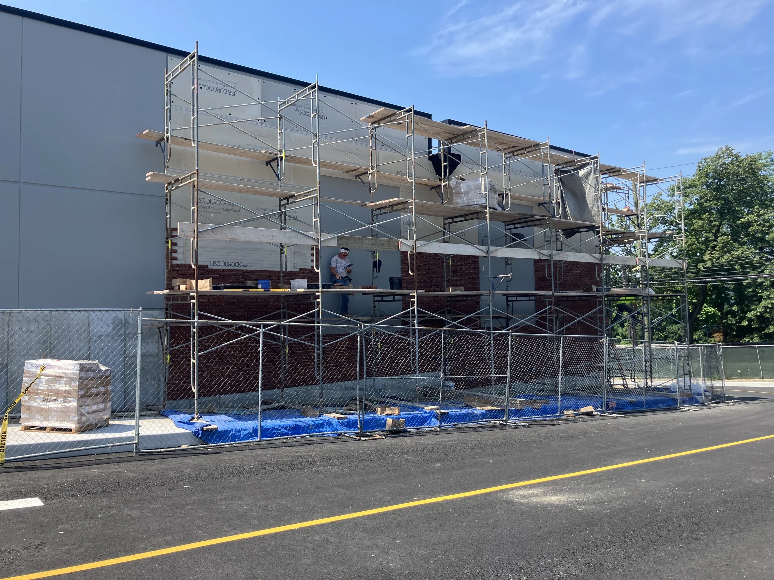 NW corner veneer and faux windows.JPEG