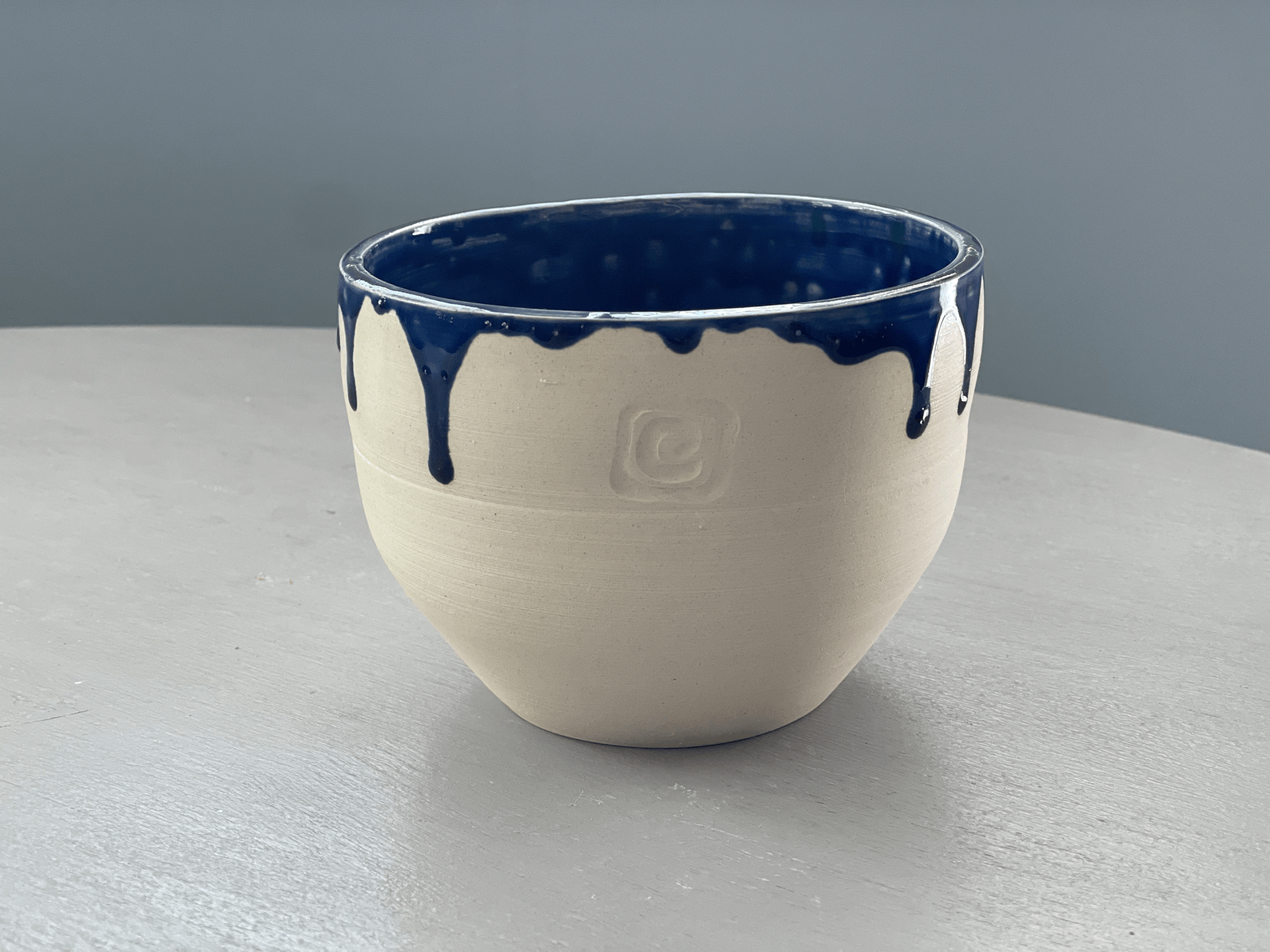 Small blue drip planter