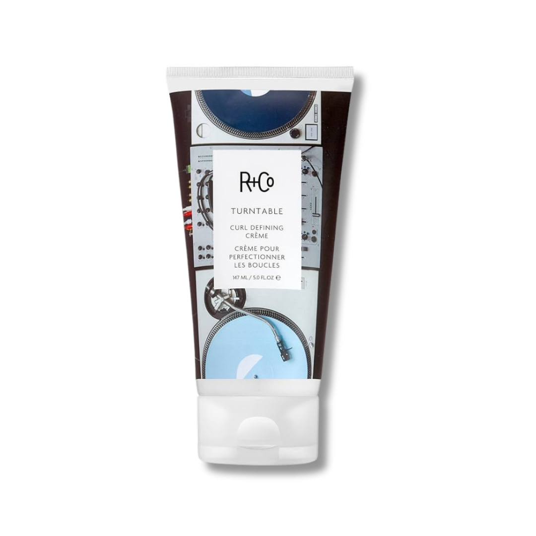R+Co Turntable Curl Defining Crème tube featuring a blue and black vinyl record player graphic.