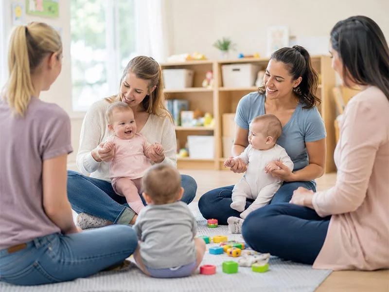 A group of moms and their newborn babies attending an event teaching parenting skills in Redding CA
