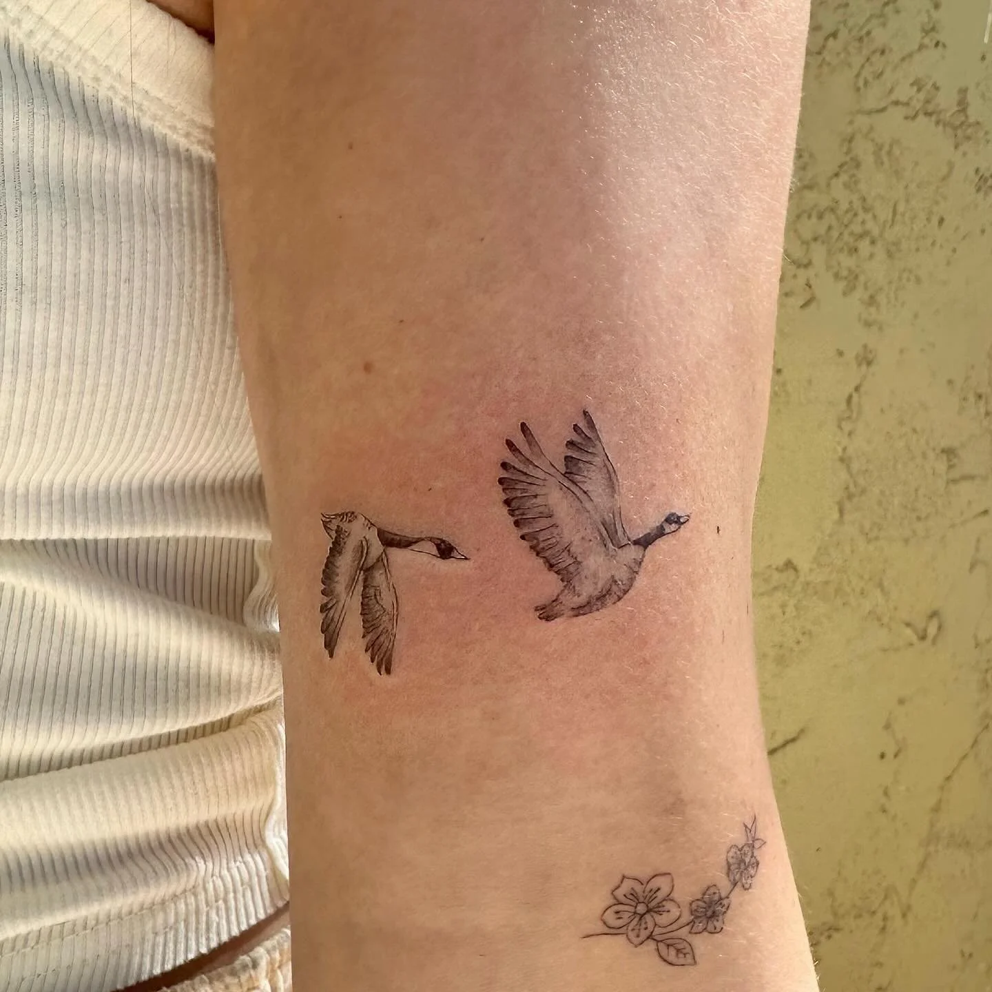 Who decided that for the birds is a bad thing?

Love these flying geese. 
Guest appearance by her little floral tattoo that is about three days into healing ✨

#geesetattoo #finelinegeese #finelinetattoo #goosetattoo #scottsdalefinelinetattoos