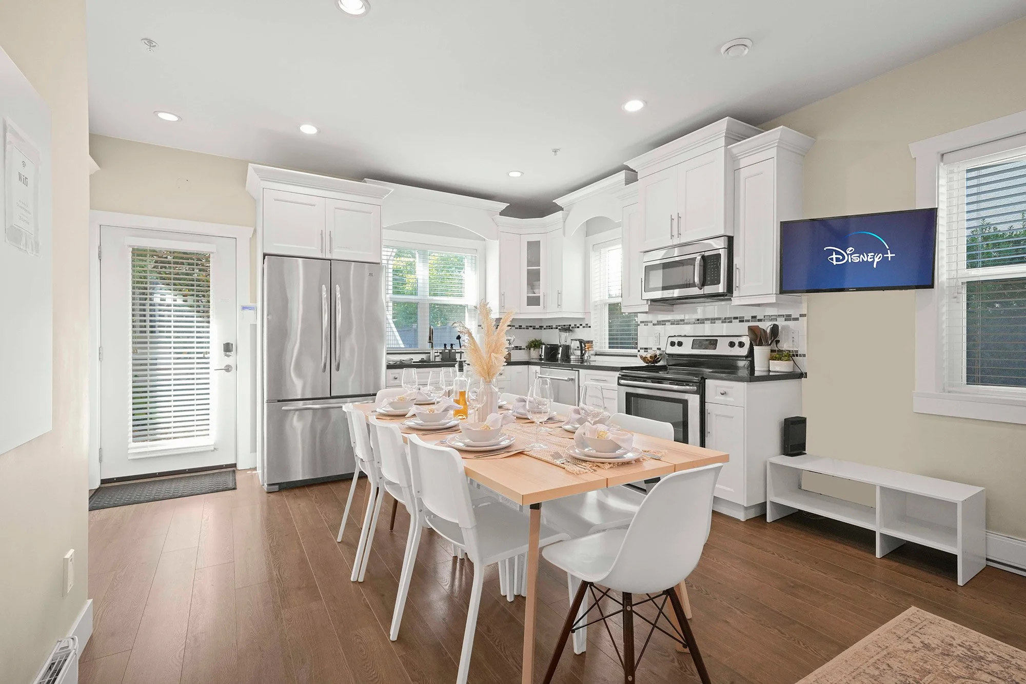 Kitchen with table set for guests