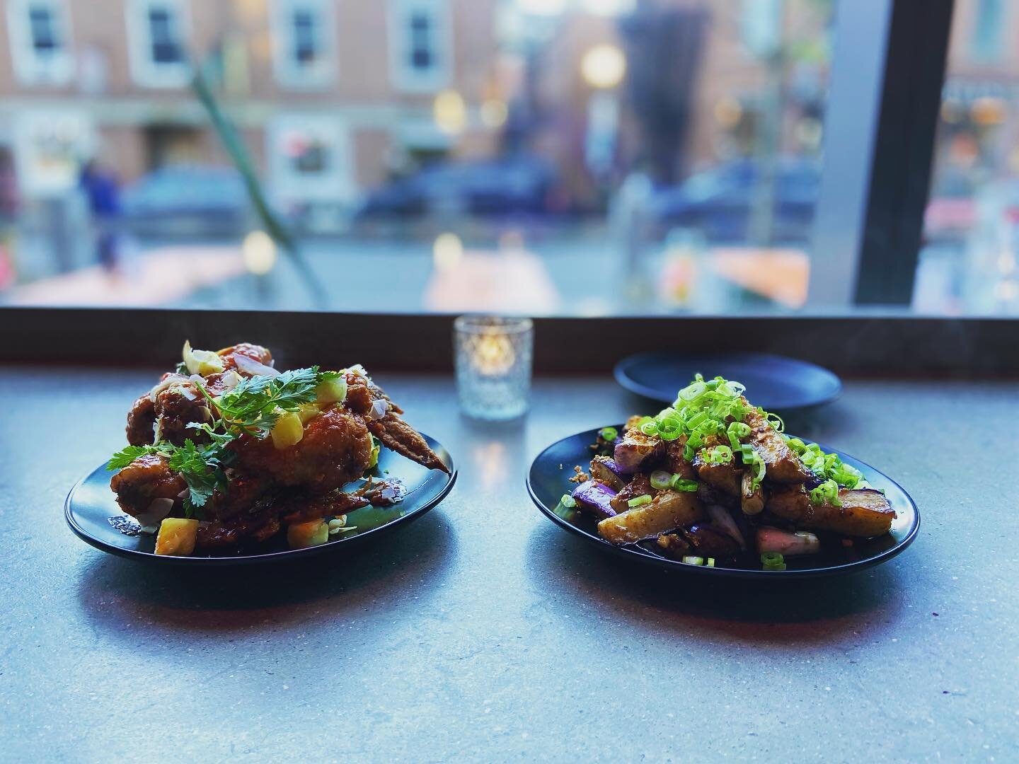 There may be no better place in #portlandmaine to sit and watch the world go by than @papertiger.me in the Old Port. Their Asian fusion has us drooling. Pictured here are the coconut wings and Japanese eggplant. Both highly recommended. 
.
.
.
#portl