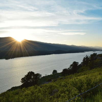 Sunset over a lake in Northern Colorado, capturing the tranquility that complements trauma counseling and healing.