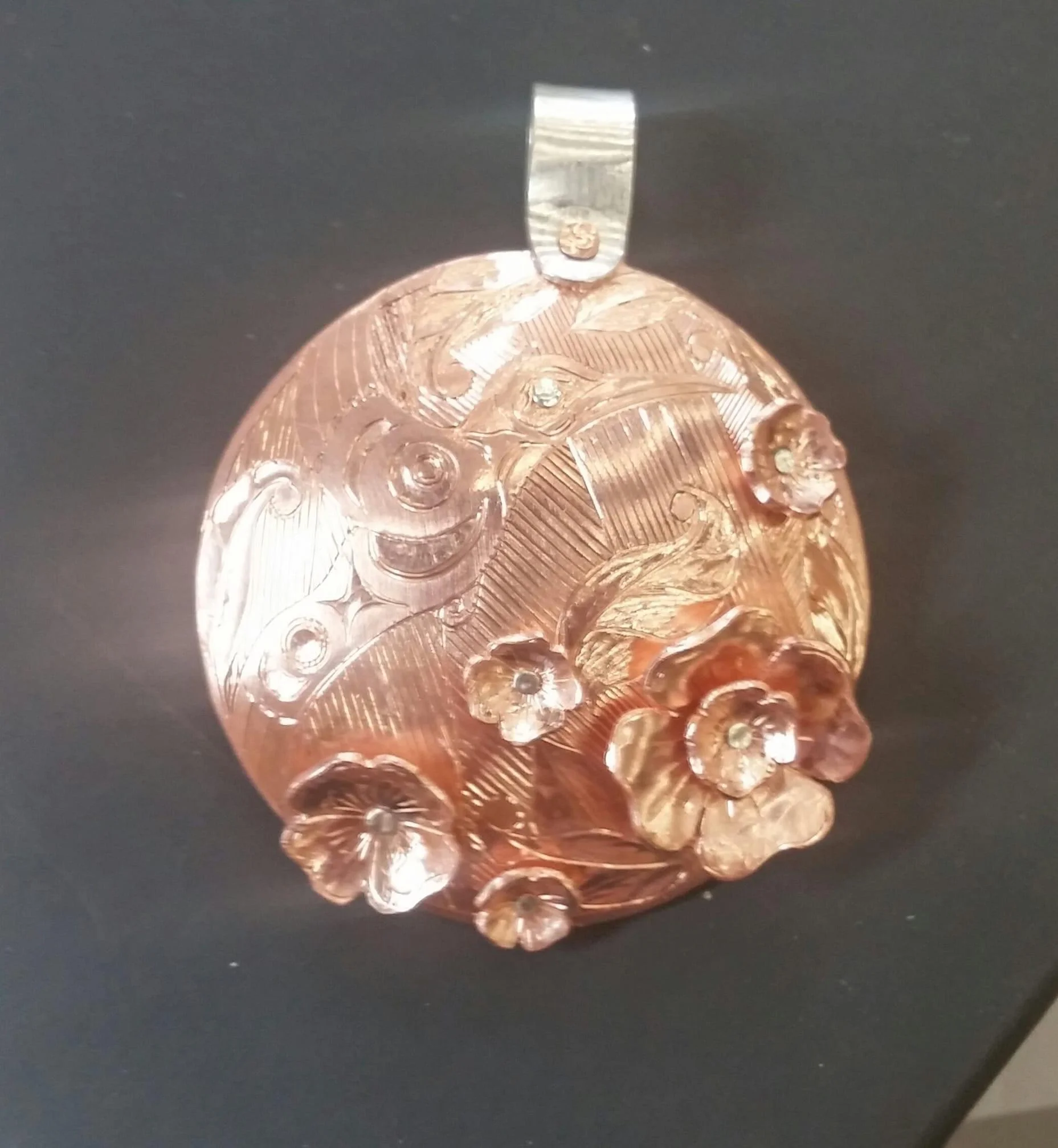 Copper pendant with hummingbird and riveted flowers *sold*