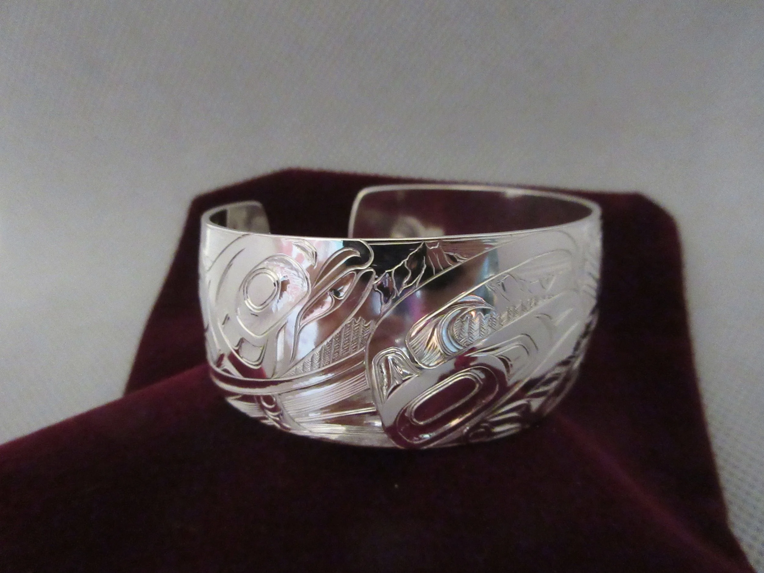 Sterling silver engraved bracelet with Northwest Coast Formline Salmon and wolf design by Arlene Ness
*sold*