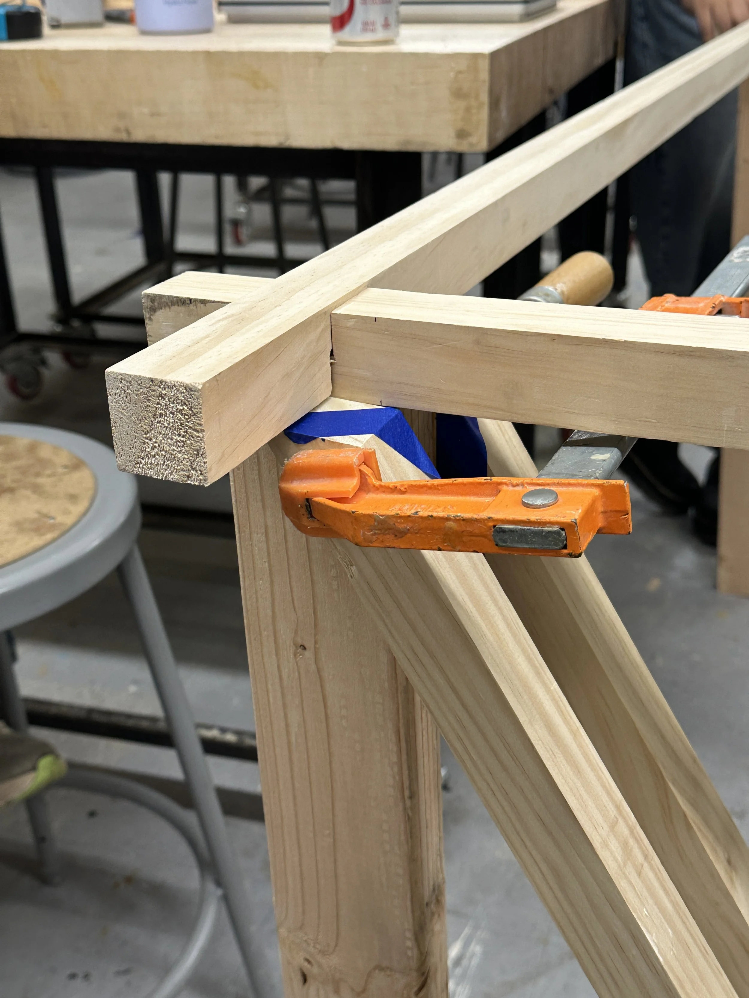 wood joint being helt together by a clamp