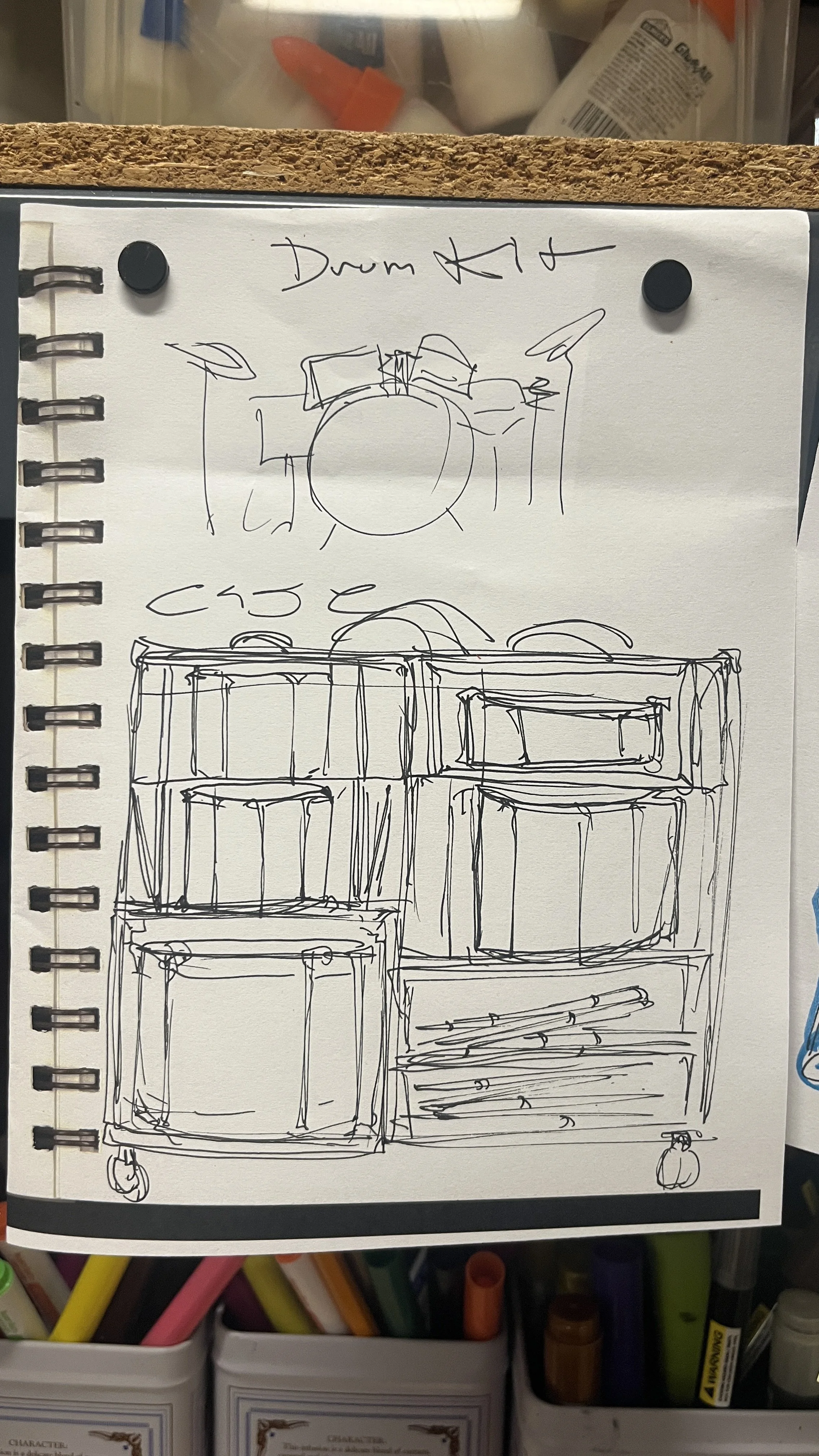 Sketch in blue marker of potential drum case design