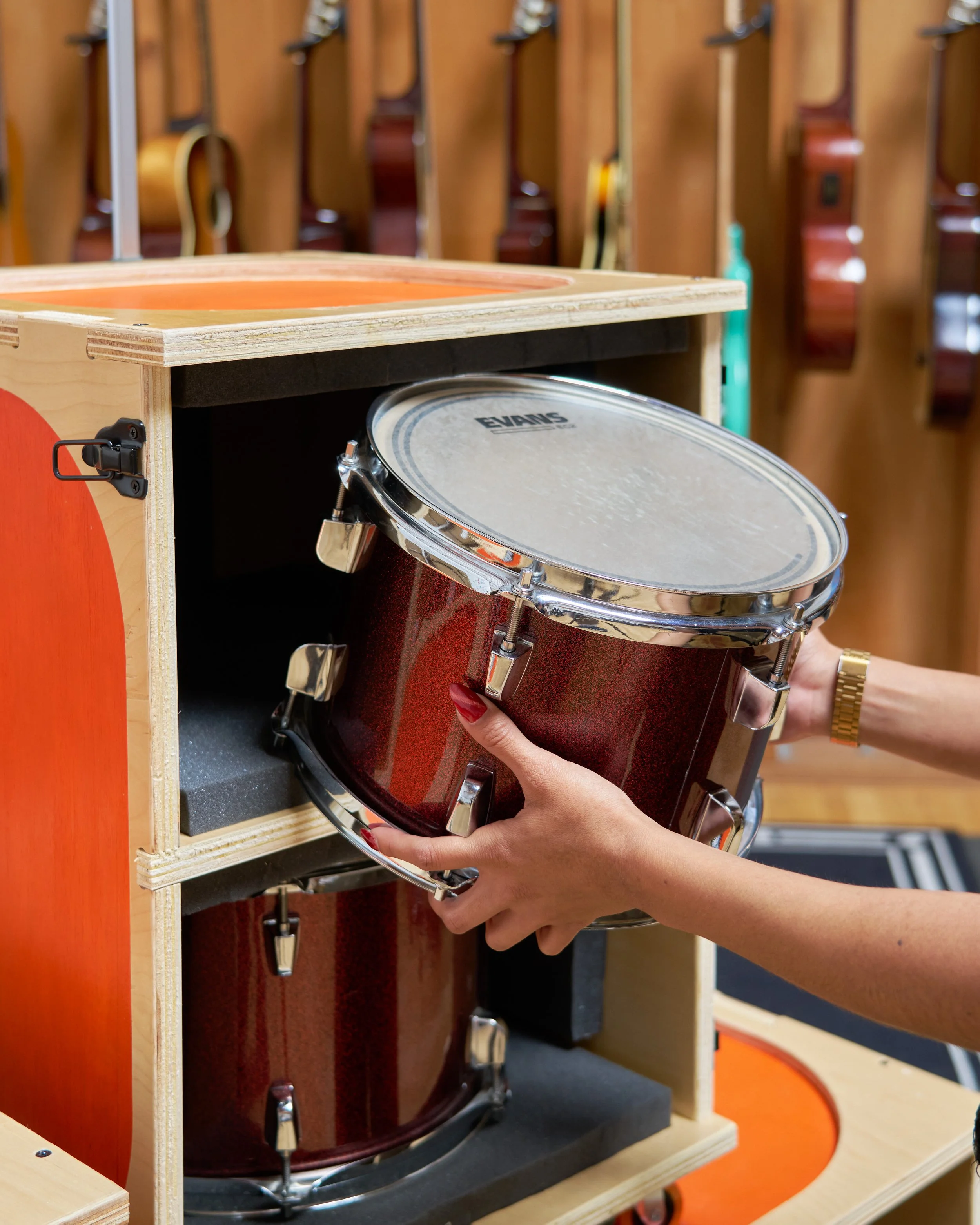  Drum being put into case by hand.